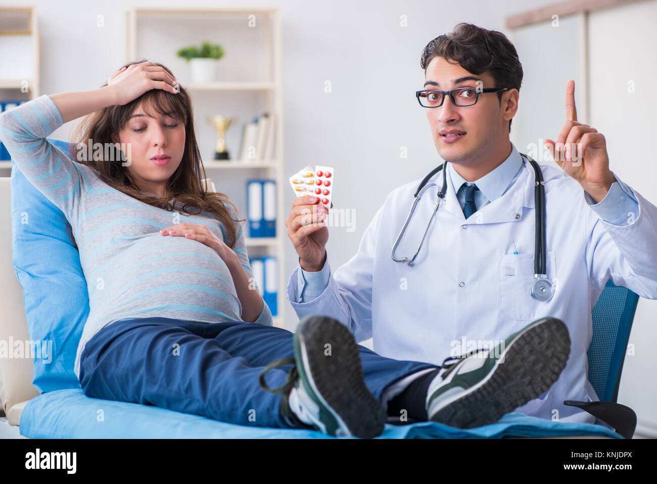 Pregnant woman visiting doctor for consultation Stock Photo - Alamy