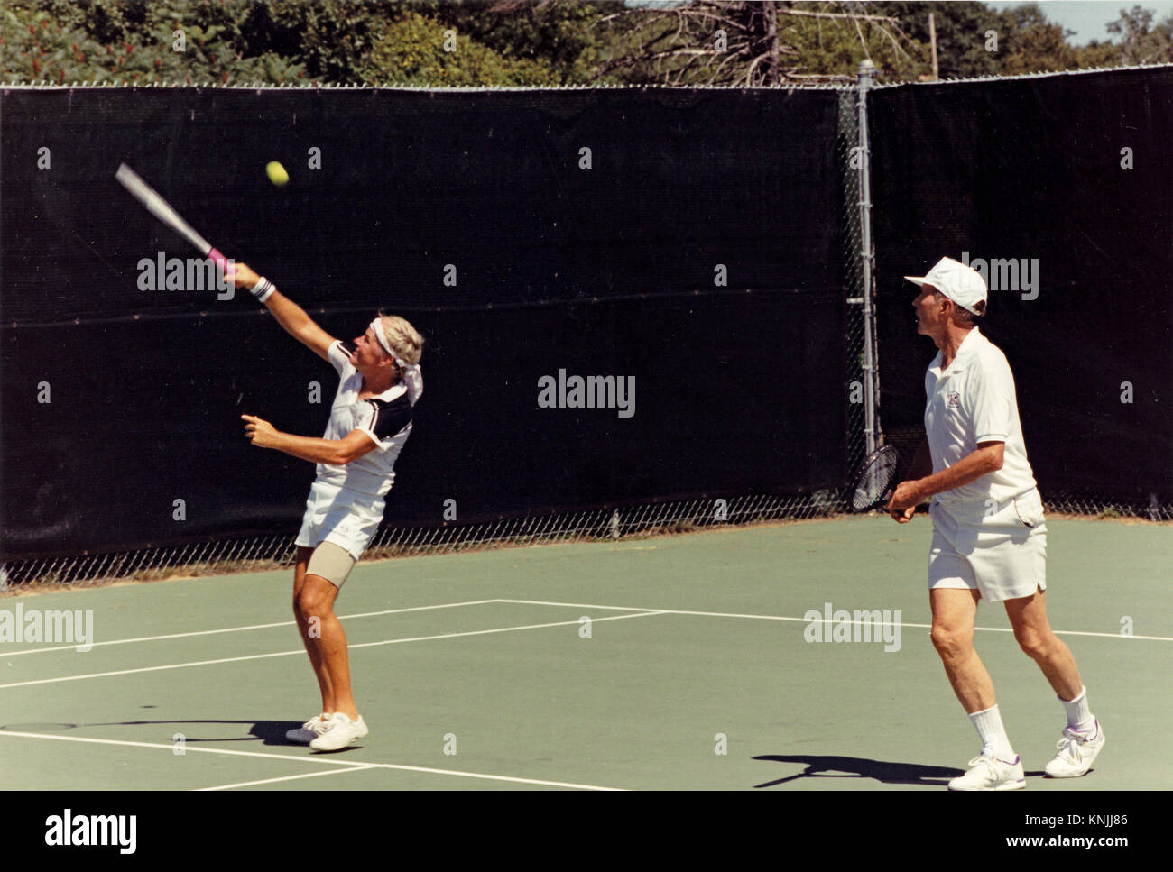 Kennebunkport, Maine, USA. 8th Aug, 1991. United States President George H.W. Bush, right, plays tennis at his summer vacation home in Kennebunkport, Maine on August 8, 1991.Mandatory Credit: David Valdez/White House via CNP Credit: David Valdez/CNP/ZUMA Wire/Alamy Live News Stock Photo