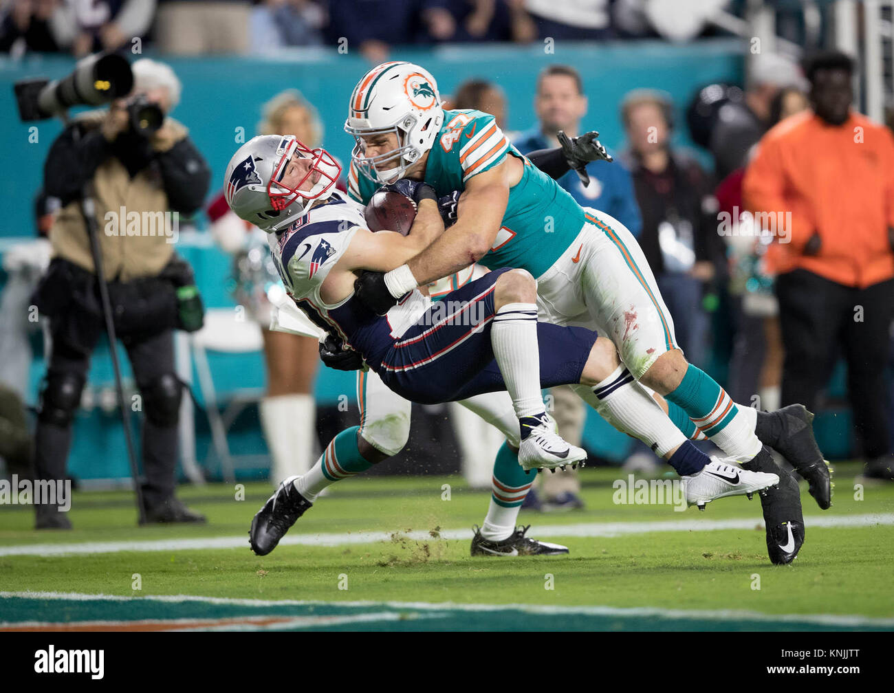 Miami Gardens, Florida, USA. 17th Aug, 2017. Miami Dolphins middle  linebacker Kiko Alonso (47) and Miami Dolphins defensive end Charles Harris  (90) surround Baltimore Ravens running back Terrance West (28) at Hard