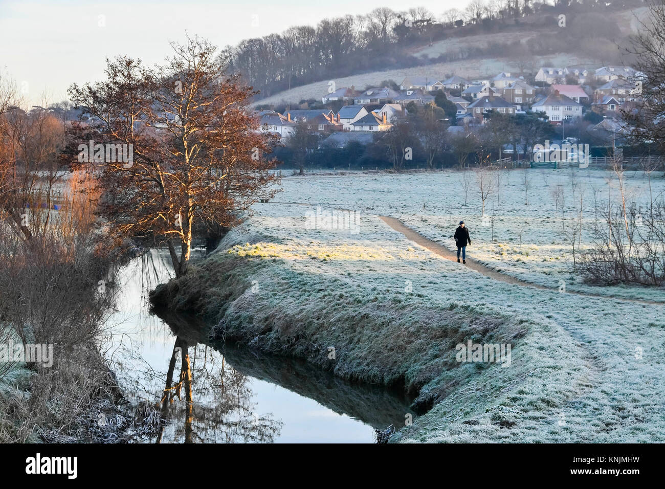 Bridport, Dorset, UK. 12th December 2017. UK Weather. A walker