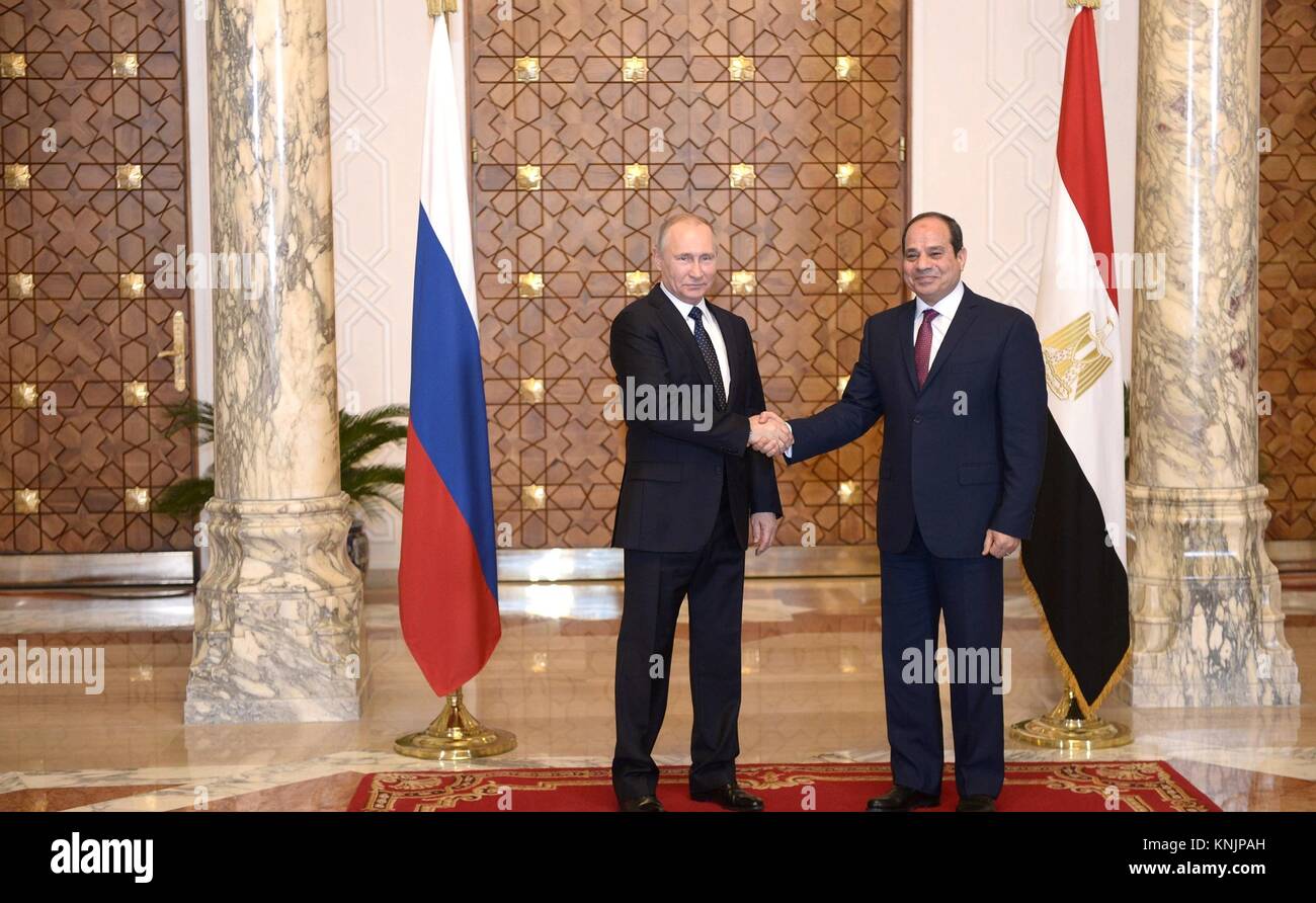 Russian President Vladimir Putin, left, is welcomed by Egyptian President Abdel Fattah el-Sisi before their bilateral meeting December 11, 2017 in Cairo, Egypt. Putin signed a $21 billion dollar deal to work on Egypt's Dabaa nuclear power plant and agreed to resume civilian flights to Egypt. Stock Photo