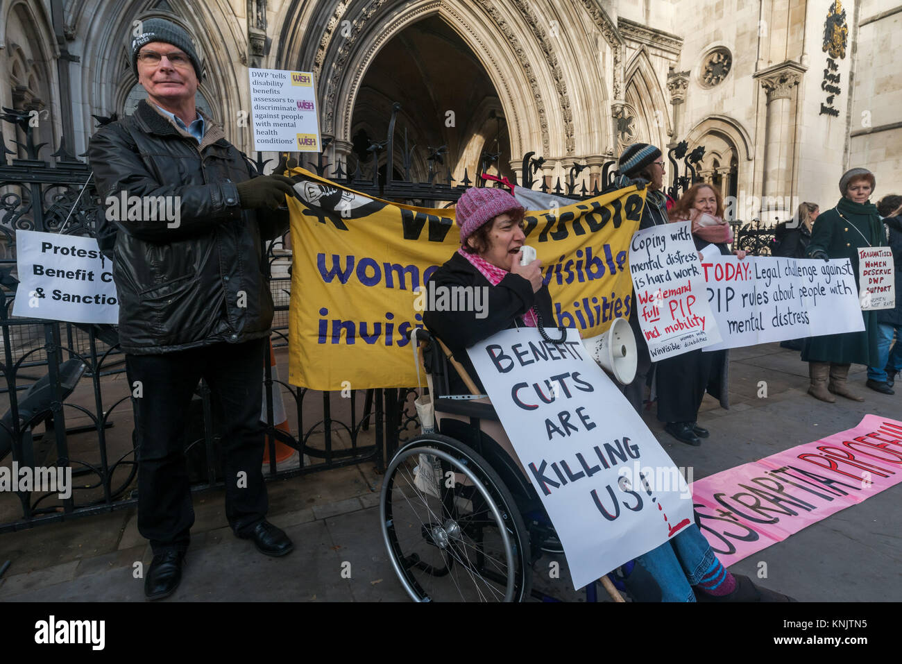 December 12, 2017 - London, UK. 12th December 2017. A lunchtime vigil by Mental Health Resistance Network, Winvisible (women with visible & invisible disabilities) and DPAC (Disabled People Against Cuts) supported the case of RF, who contends that the way people experiencing psychological distress are treated by new Personal Independence Payment (PIP) rules is unfair and discriminatory, being held at the High Court. Changes to the rules made in March 2017 by the Dept of Work & Pensions mean that those with serious mental health conditions who are unable to plan or undertake a journey because o Stock Photo