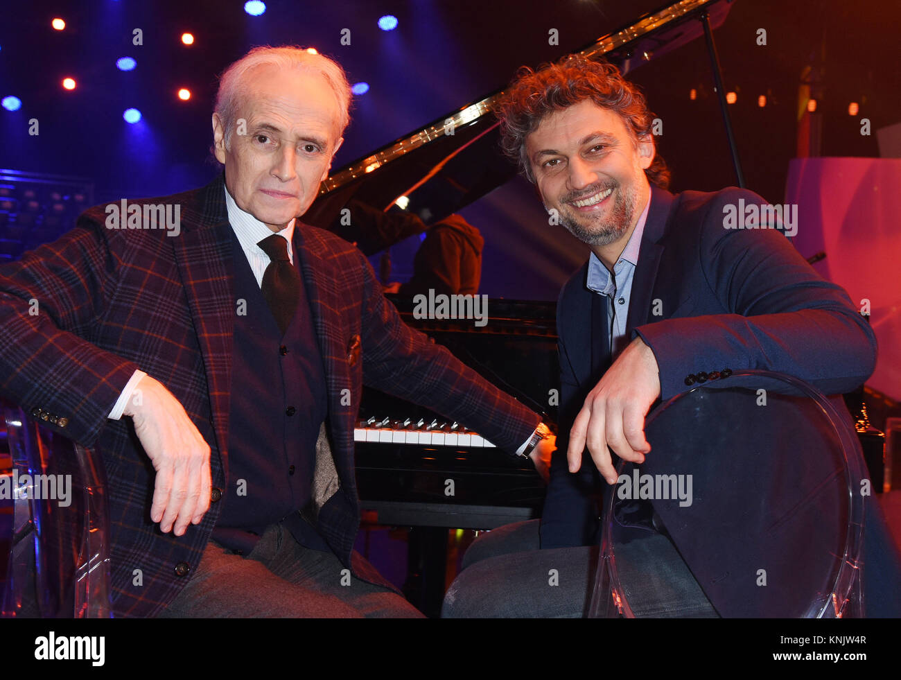 Munich, Germany. 12th Dec, 2017. Jose Carreras (L), spanish opera singer and founder of the 'José Carreras Leukaemia Foundation' and Jonas Kaufmann, opera singer and foundation ambassador, sit by a grand piano during rehearsals for the 'Jose Carreras Gala' in the Bavaria Studios in Munich, Germany, 12 December 2017. The gala is taking place on 14 December 2017. Credit: Ursula Düren/dpa/Alamy Live News Stock Photo