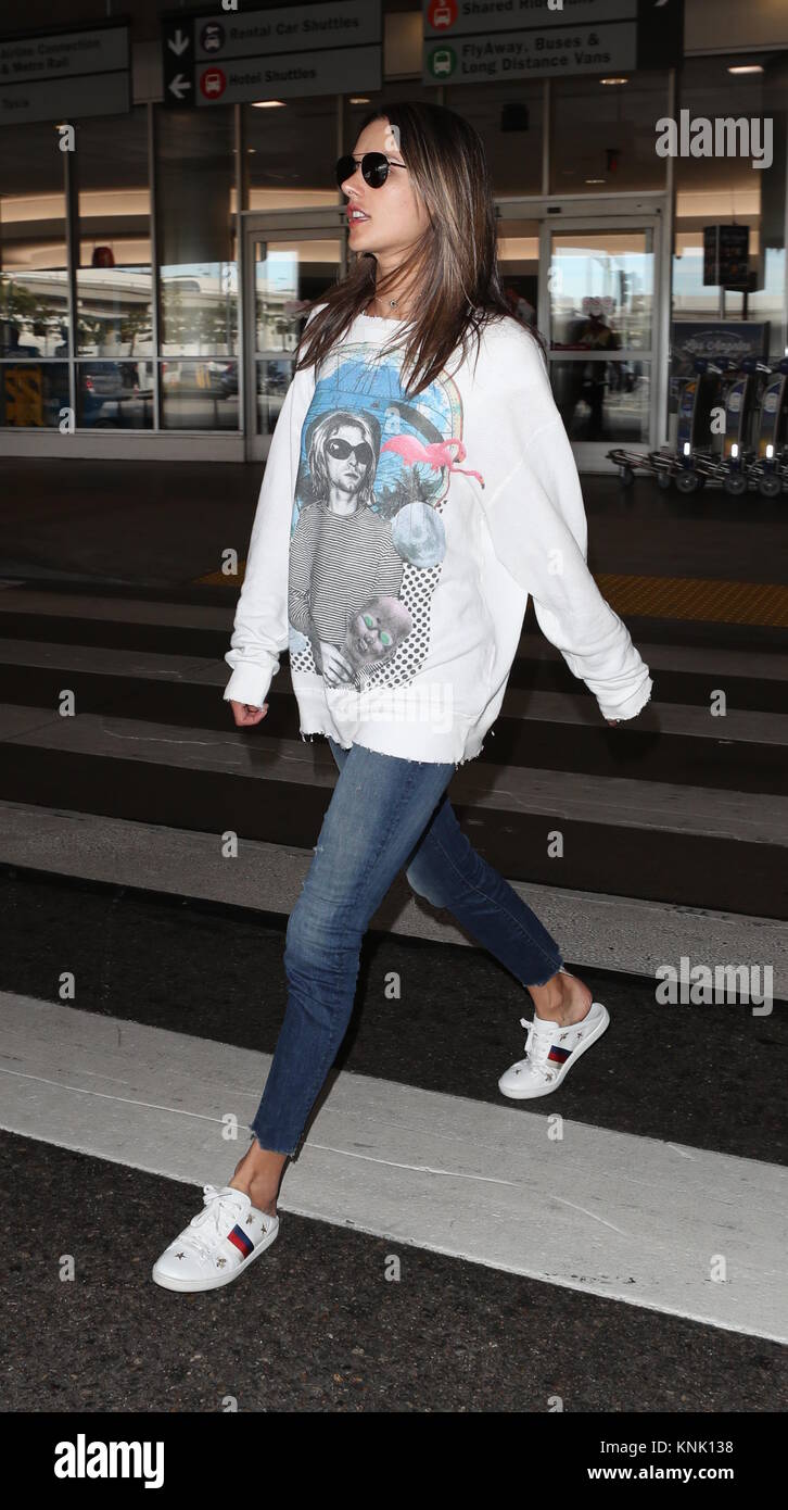 Alessandra Ambrosio arrives at Los Angeles International (LAX) Airport,  wearing an oversized Kurt Cobain printed sweatshirt.
