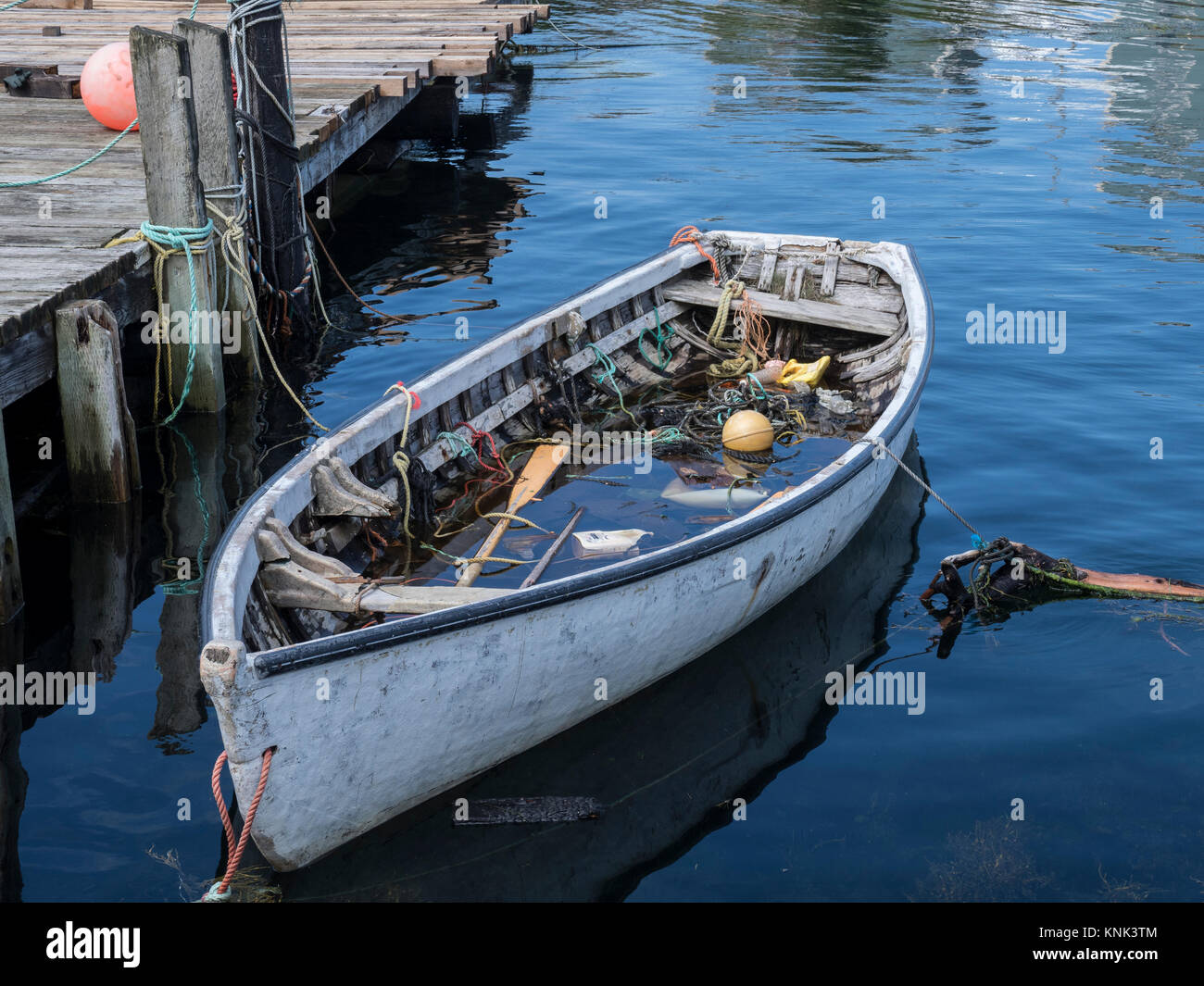 Water-filled boat, harbor, Peggy's Cove, Nova Scotia, Canada. Stock Photo