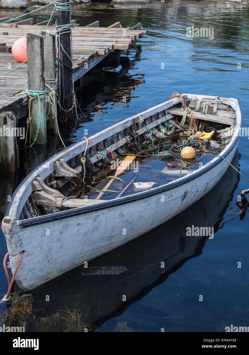 Waterfilled boat, harbor, Peggy's Cove, Nova Scotia, Canada Stock