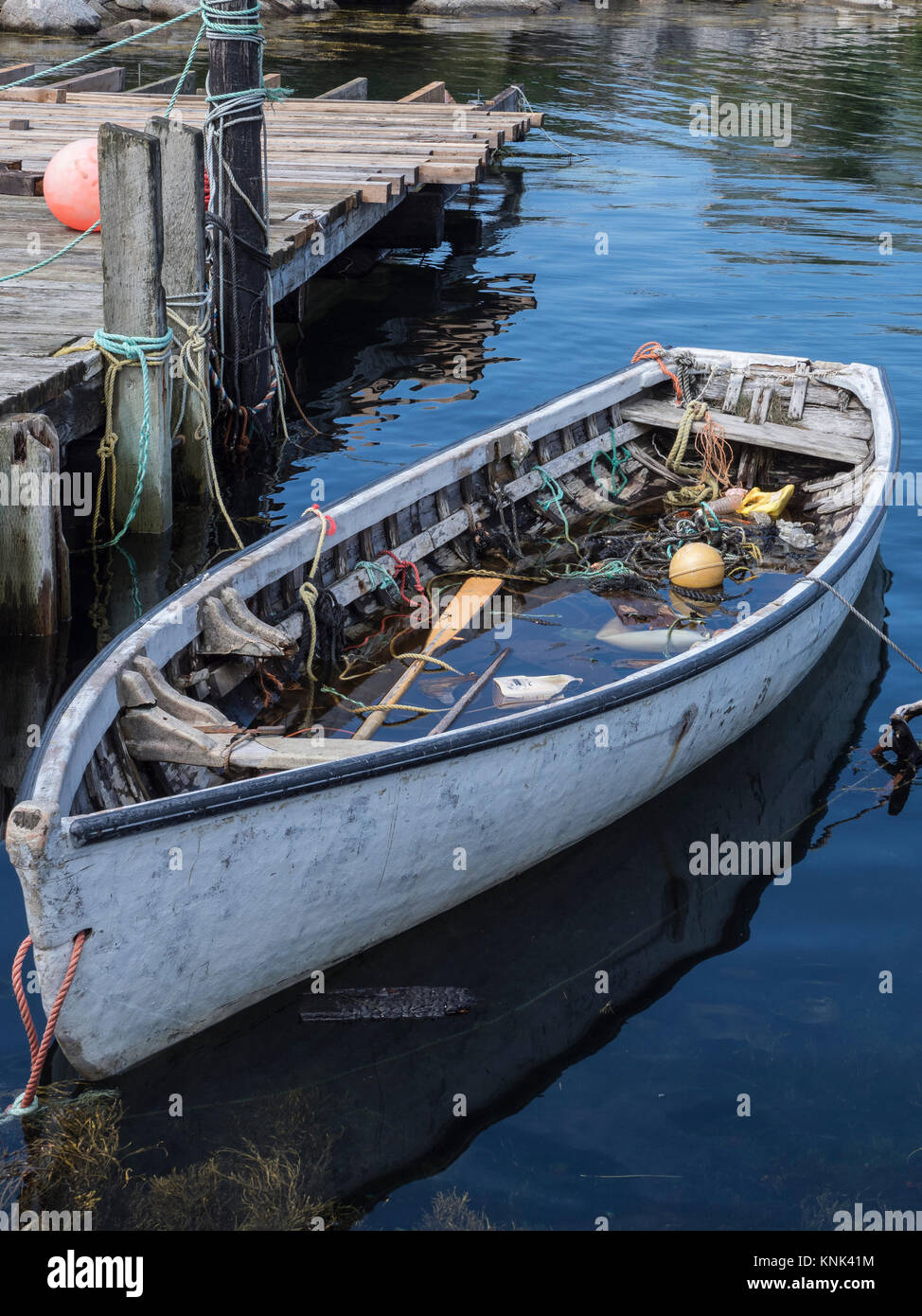 Water-filled boat, harbor, Peggy's Cove, Nova Scotia, Canada. Stock Photo