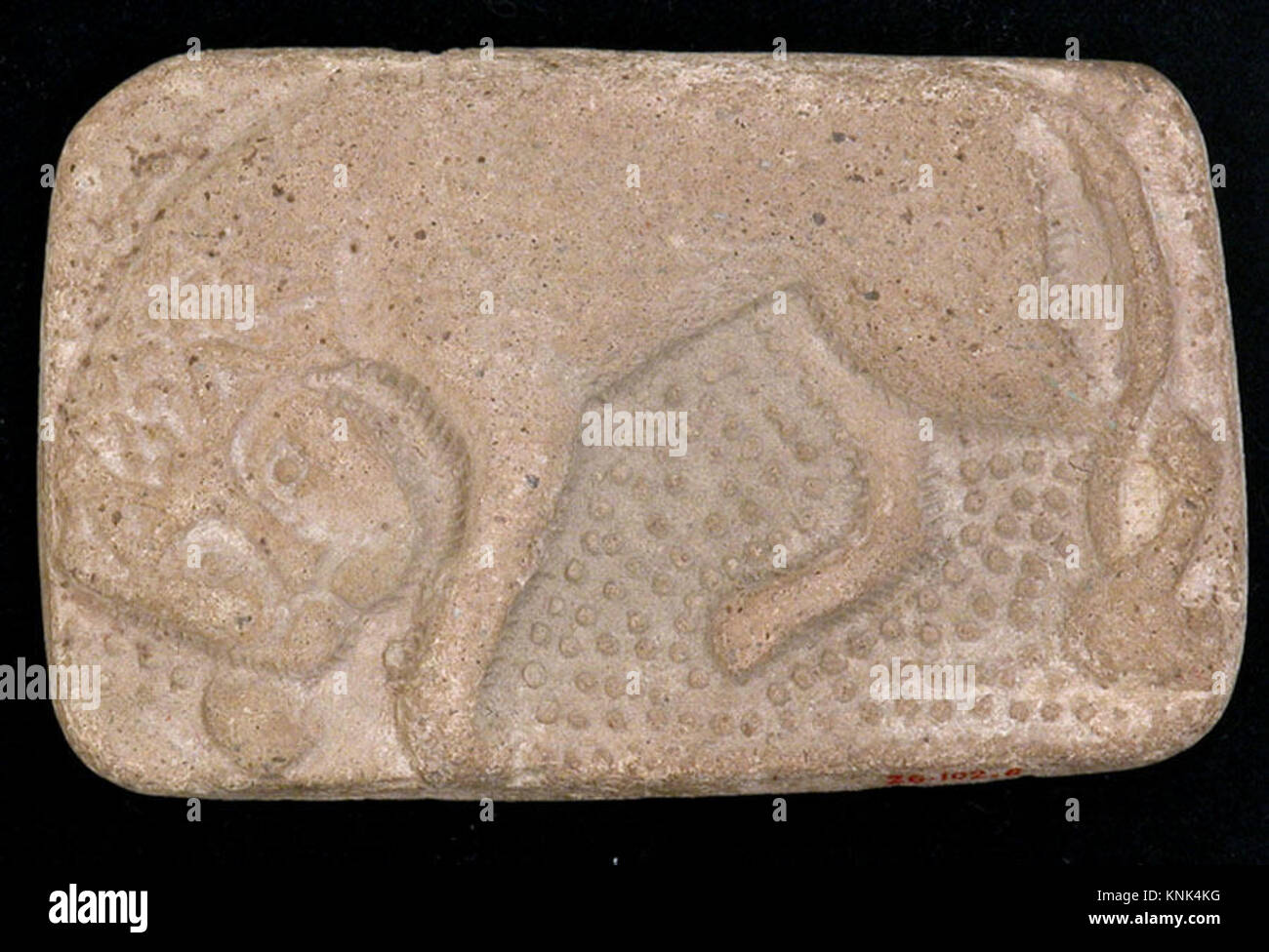 A 12th-13th century earthenware bath scraper from Iran, unglazed ...