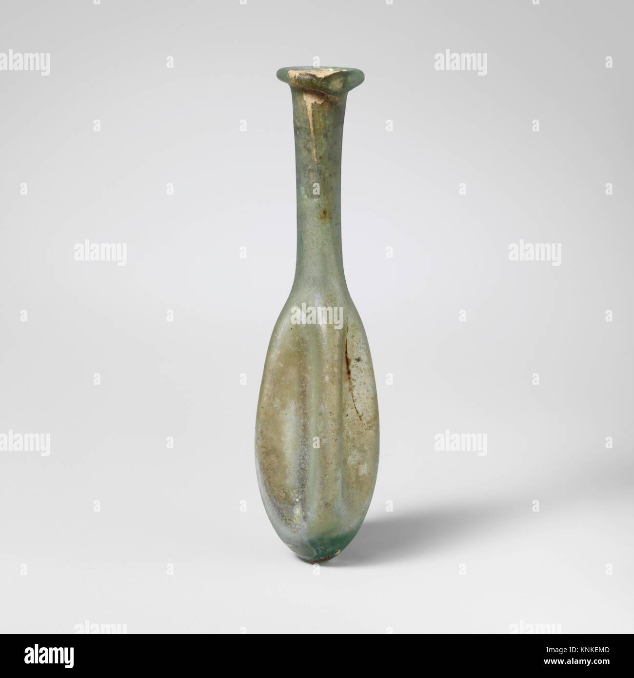Glass perfume bottle. Period: Mid Imperial; Date: 2nd-3rd century A.D; Culture: Roman; Medium: Glass; blown; Dimensions: 4 5/8 x 7/8in. (11.7 x Stock Photo