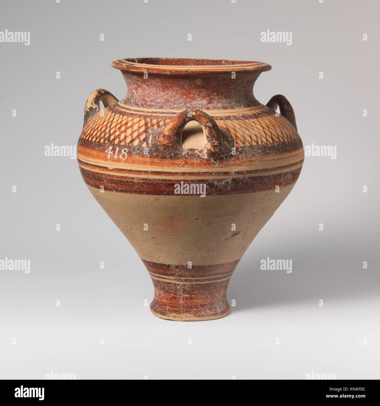 Terracotta pithoid jar. Period: Late Helladic IIIA1-2 early; Date: ca. 1400-1350 B.C; Culture: Mycenaean; Medium: Terracotta; Dimensions: H. 6 5/16 Stock Photo