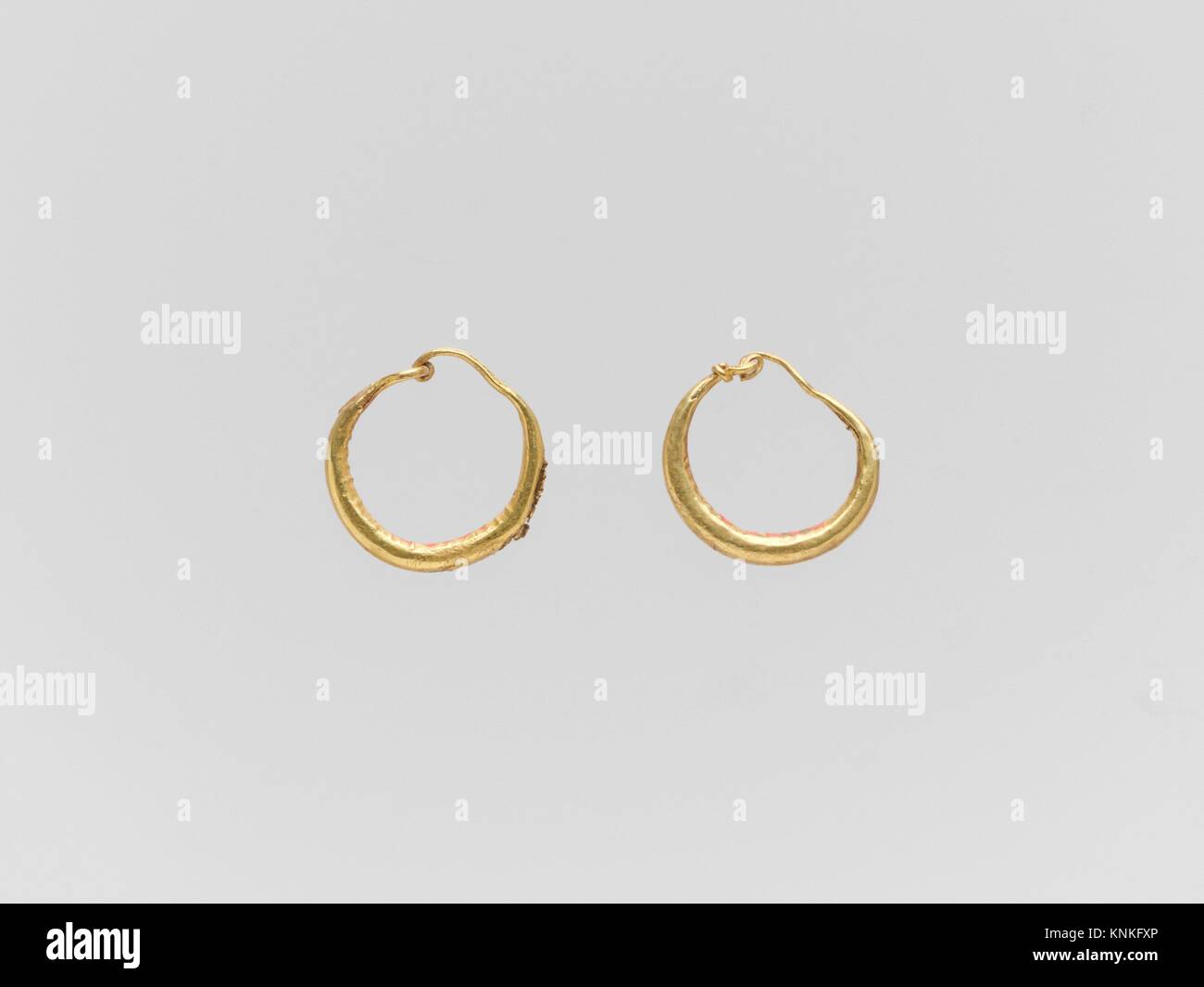 Gold loop earring hi-res stock photography and images - Alamy