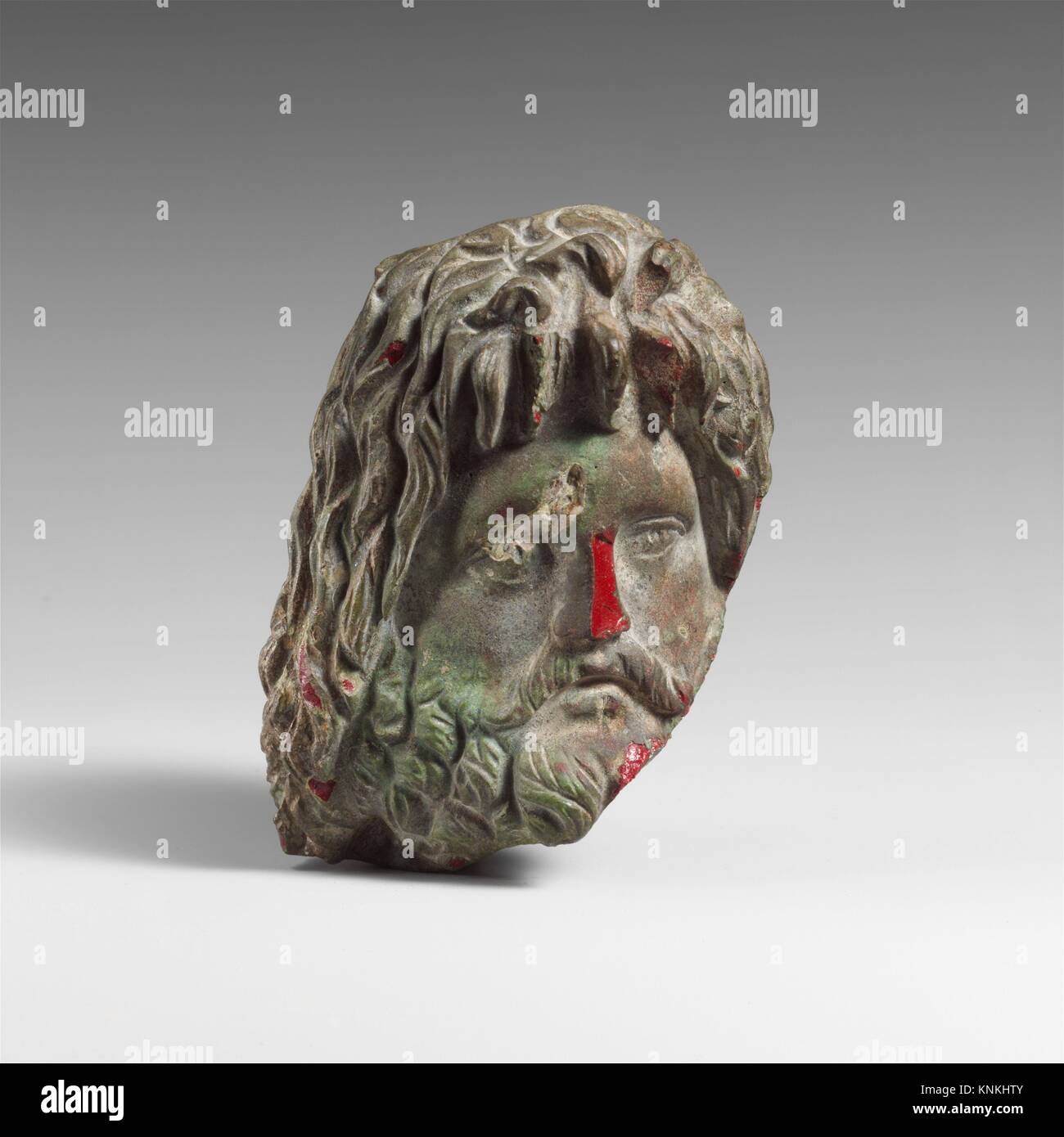 Glass head of Zeus Sarapis. Period: Early or Mid Imperial; Date: 1st-2nd century A.D; Culture: Roman; Medium: Glass; cast and carved; Dimensions: H. Stock Photo