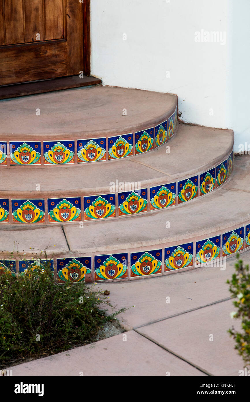 Closeup detail of tiles on entry steps at a home. An intricate design