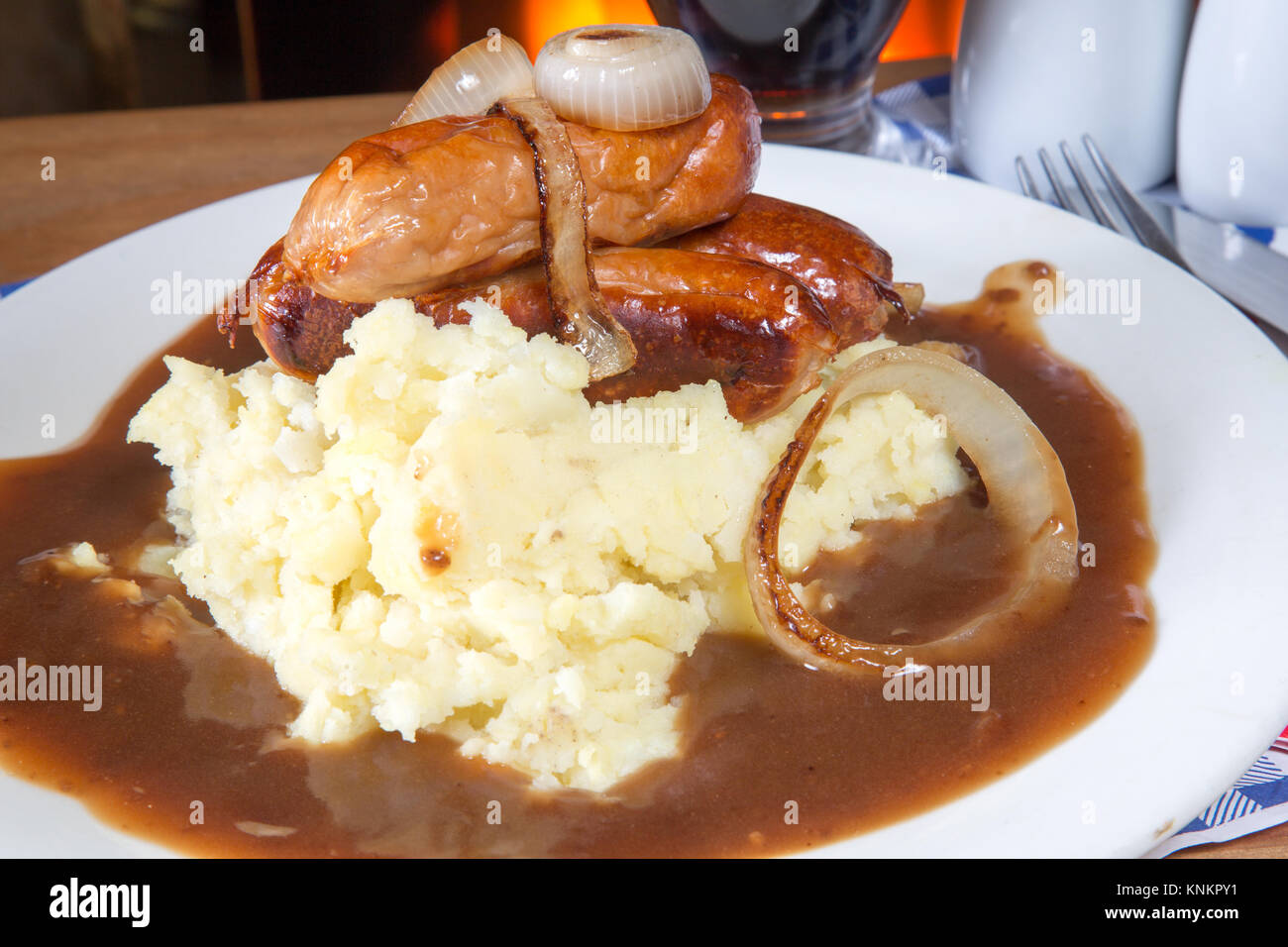 An English pub/restaurant dish of Sausage, Mashed potato and gravy