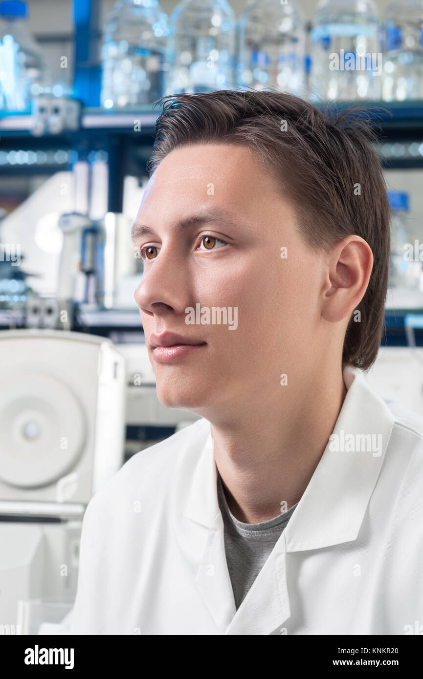 Portrait of a young scientist or tech in modern laboratory Stock Photo