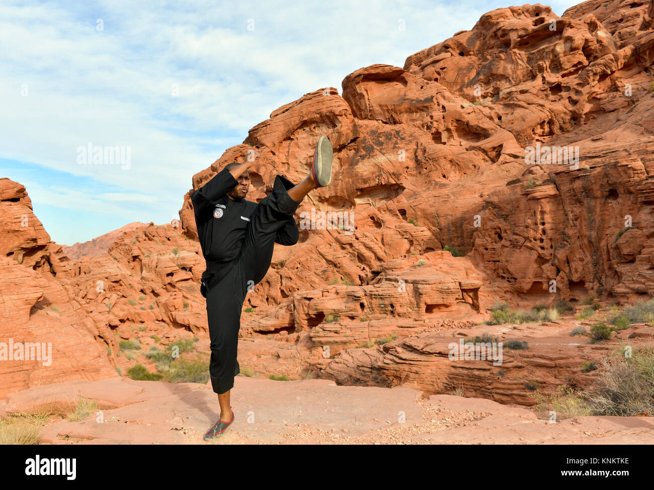 African American man practicing martial arts in the Nevada desert. Stock Photo
