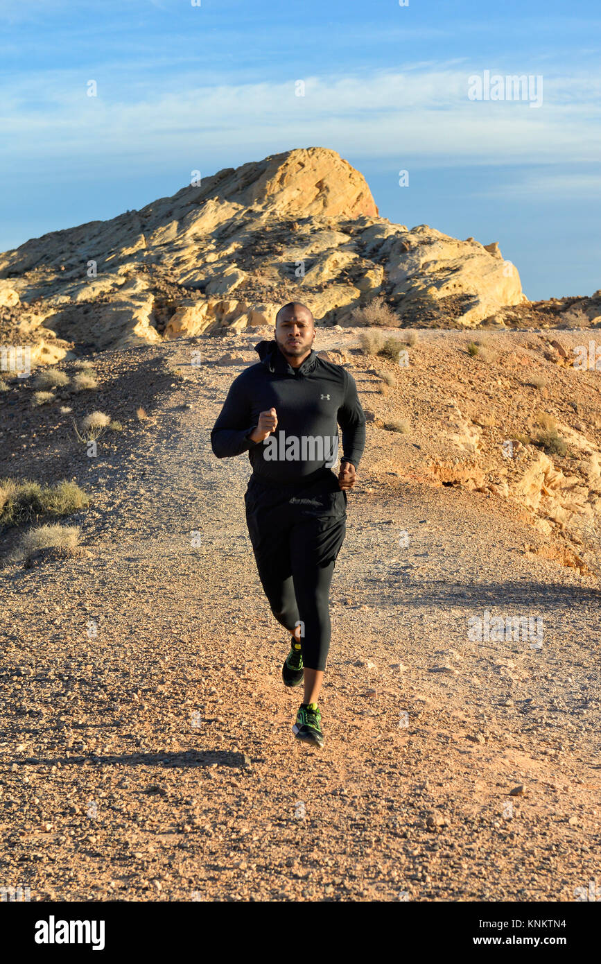 African American man training for 10k run in the Nevada desert. Stock Photo