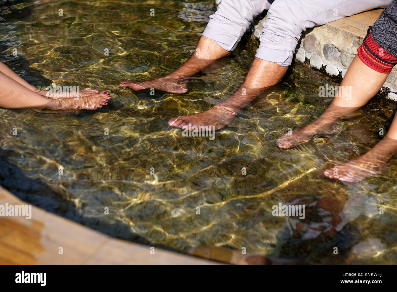 People warm their feet in a hot spring Stock Photo Alamy