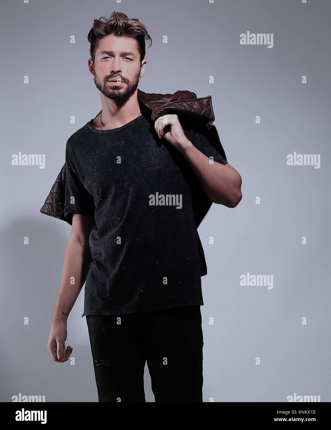 Portrait of a pensive handsome man over gray background Stock Photo - Alamy