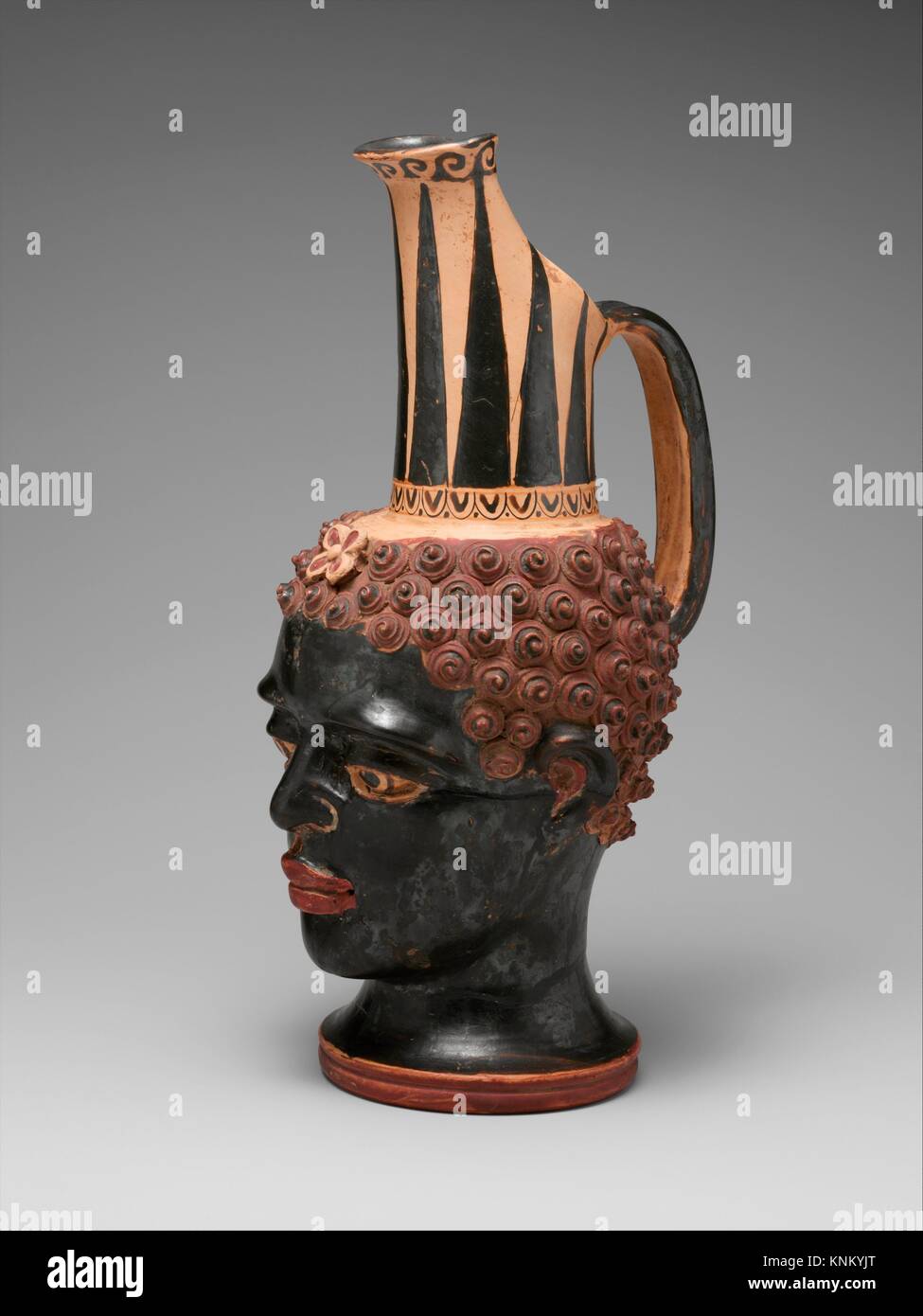 Terracotta vase in the form of a black African youth´s head. Attributed to the Negro Boy Group; Period: Classical; Date: 4th century B.C; Culture: Stock Photo