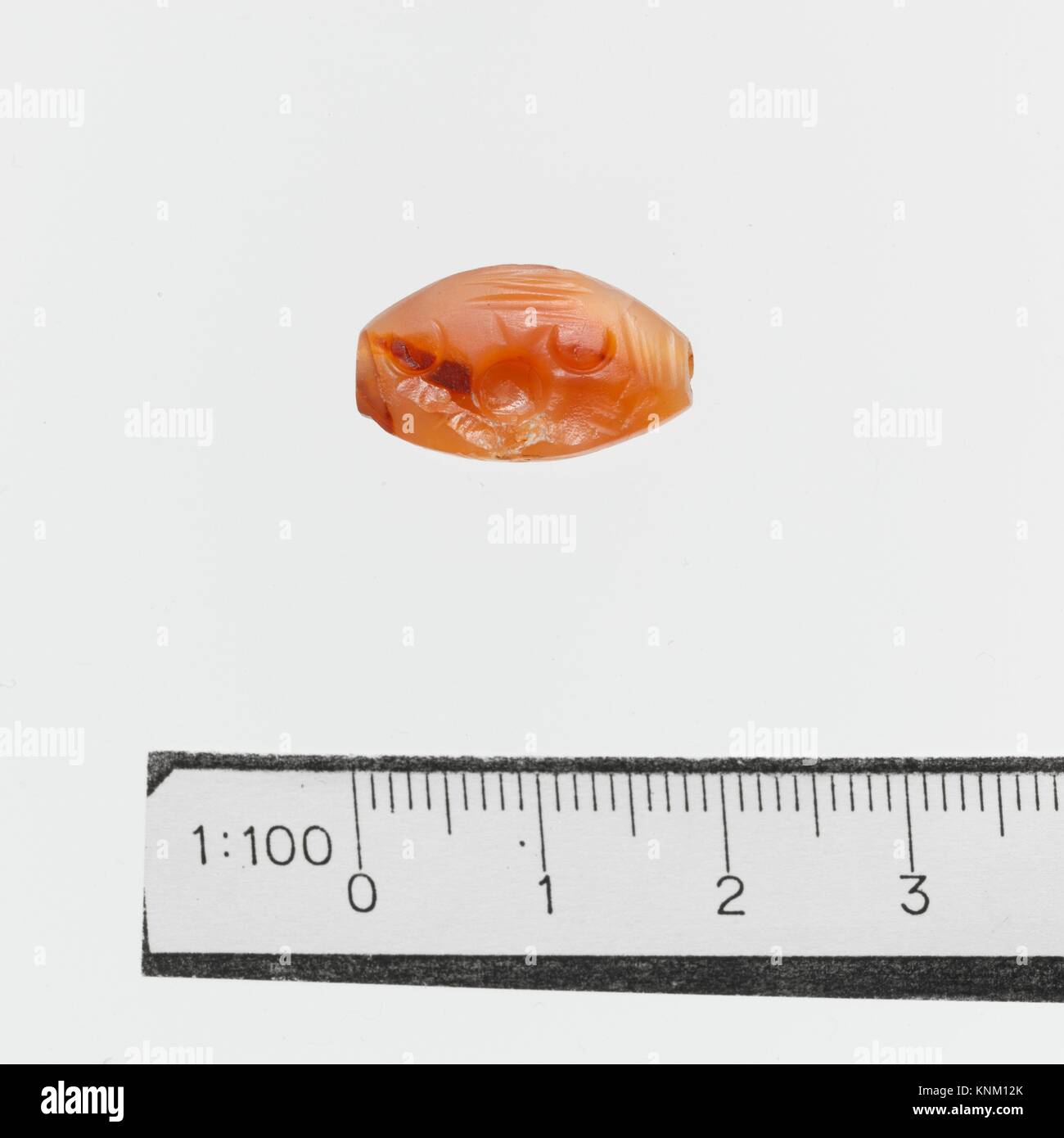 Seal. Culture: Minoan, Crete; Medium: Sard; Dimensions: Other: 7/16 x 11/16 in. (1.1 x 1.8 cm); Classification: Gems Stock Photo
