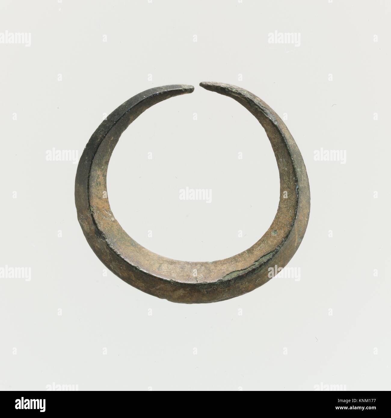 Bronze annular earring. Period: Bronze Age; Date: 2nd millennium B.C; Culture: Minoan; Medium: Bronze; Dimensions: Diameter 7/8 in. (2.1 cm); Stock Photo