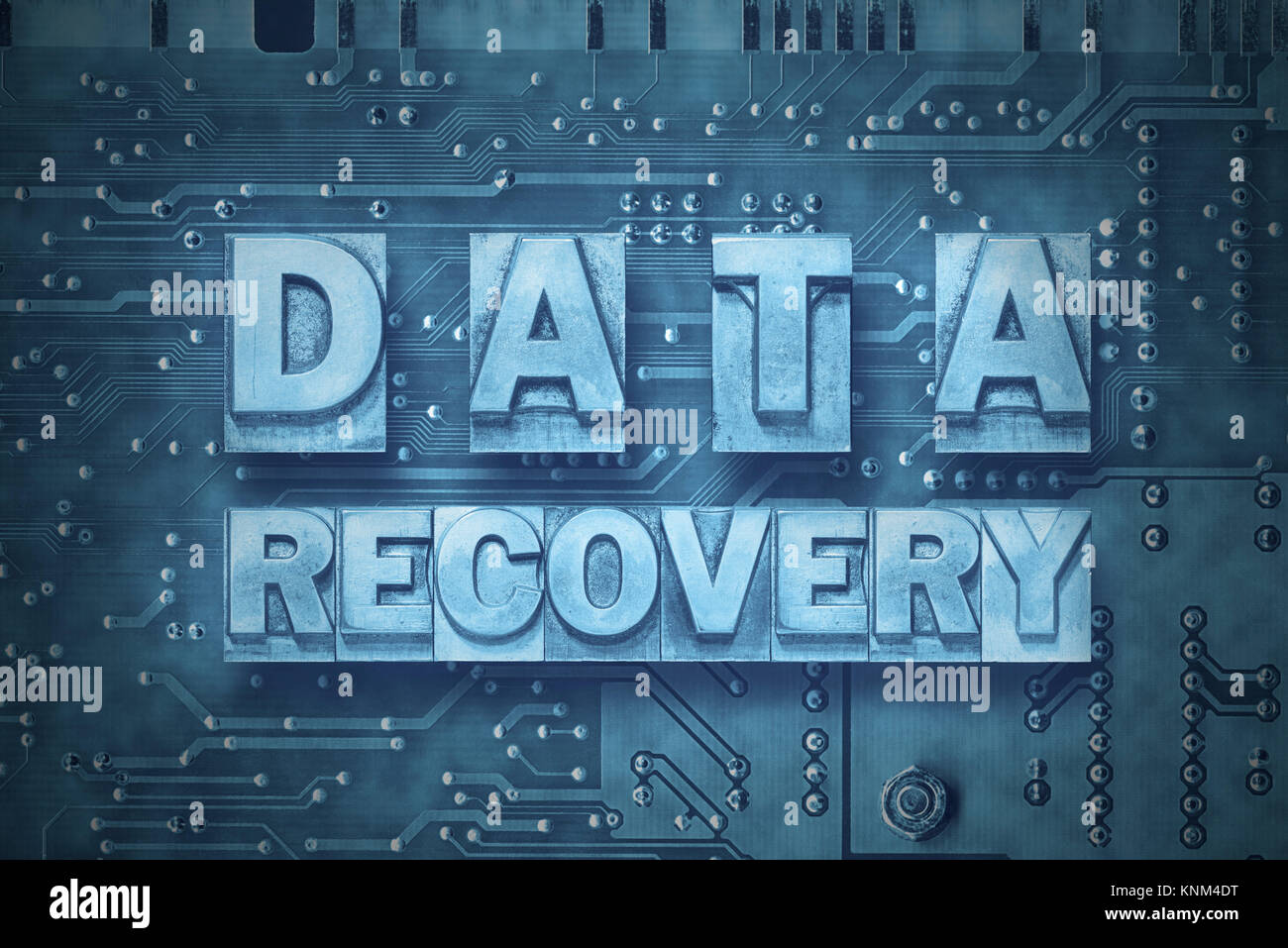 data recovery phrase made from metallic letterpress blocks on the pc board background Stock Photo