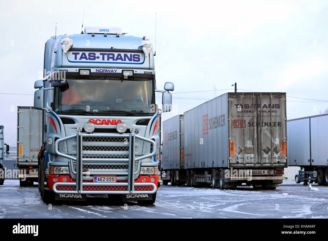 FORSSA, FINLAND - DECEMBER 20, 2014: Fleet of Scania trailer trucks on a yard. Demand for heavy trucks is increasing while the need for medium-duty ha Stock Photo