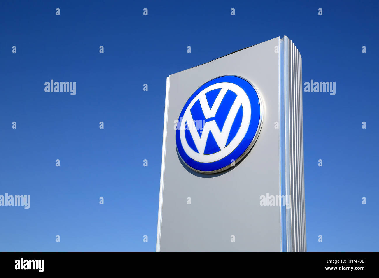 FORSSA, FINLAND - MAY 17, 2014: Sign Volkswagen against blue sky. The Volkswagen Group delivered over 9 million vehicles in period from January to Nov Stock Photo