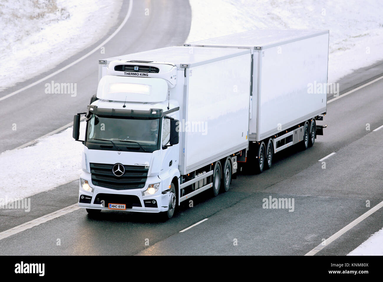SALO, FINLAND - NOVEMBER 23, 2014: Mercedes-Benz Actros temperature controlled truck on motorway. Refrigerated trucks can haul a variety of goods that Stock Photo