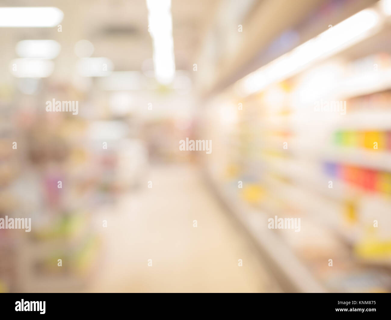 Blurred supermarket pass with colorful shelves as background Stock ...