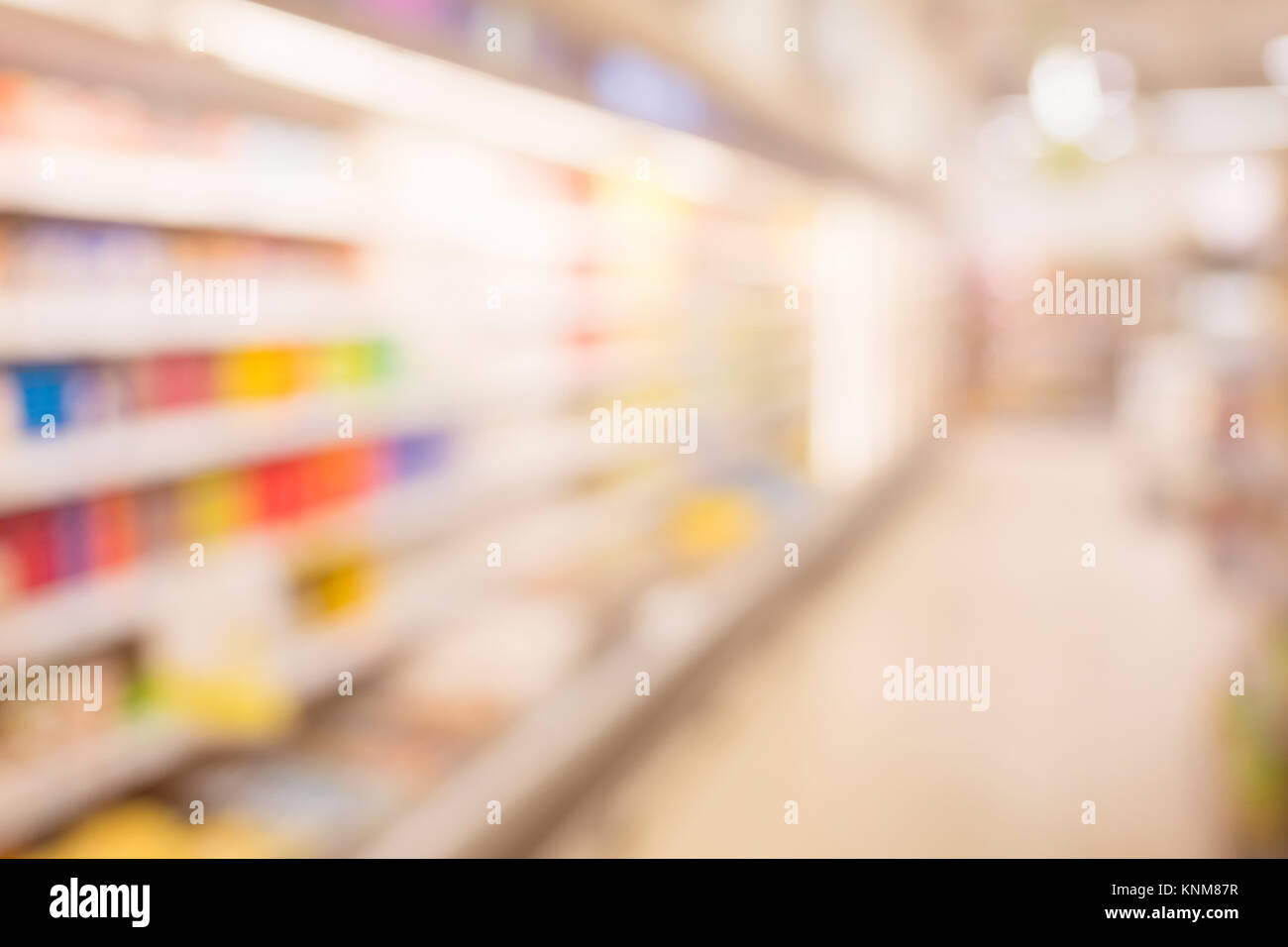Blurred supermarket pass with colorful shelves as background. Stock Photo