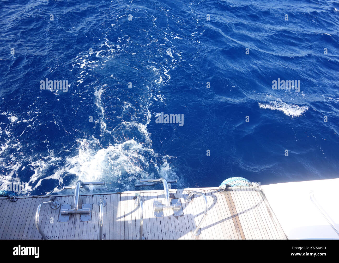 Trail of boat on water surface Stock Photo - Alamy
