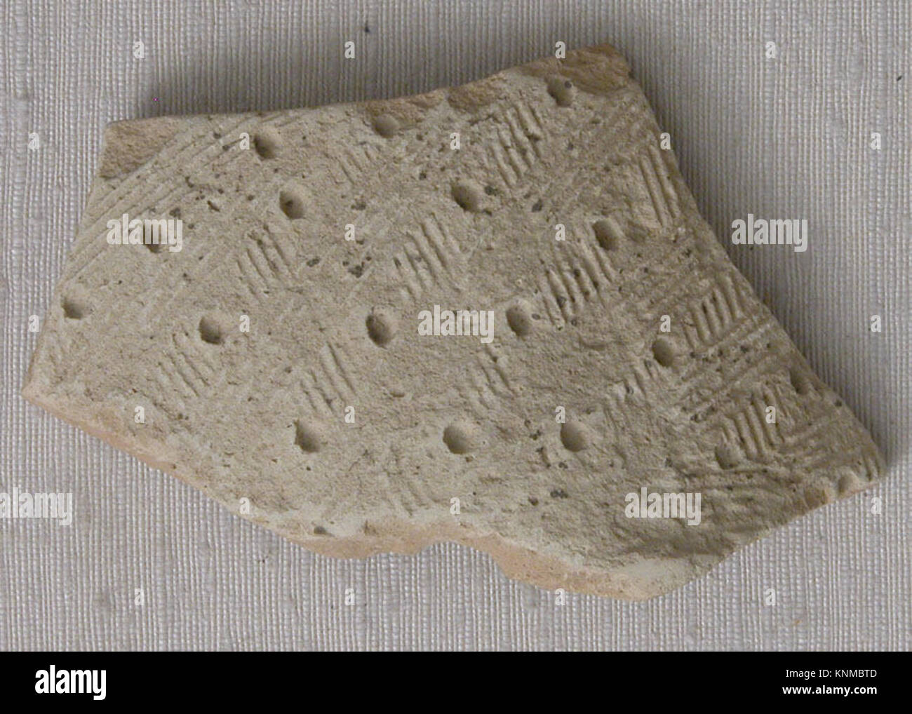 Fragment, 8th-9th century, Found/excavated Iraq, Ctesiphon, Medium: Earthenware; stamped Stock Photo