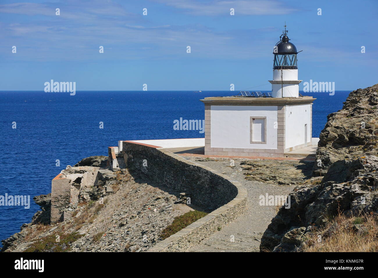Spain Cadaques Cala Nans lighthouse on the Mediterranean sea shore, Costa Brava, Cap de Creus, Alt Emporda, Catalonia Stock Photo