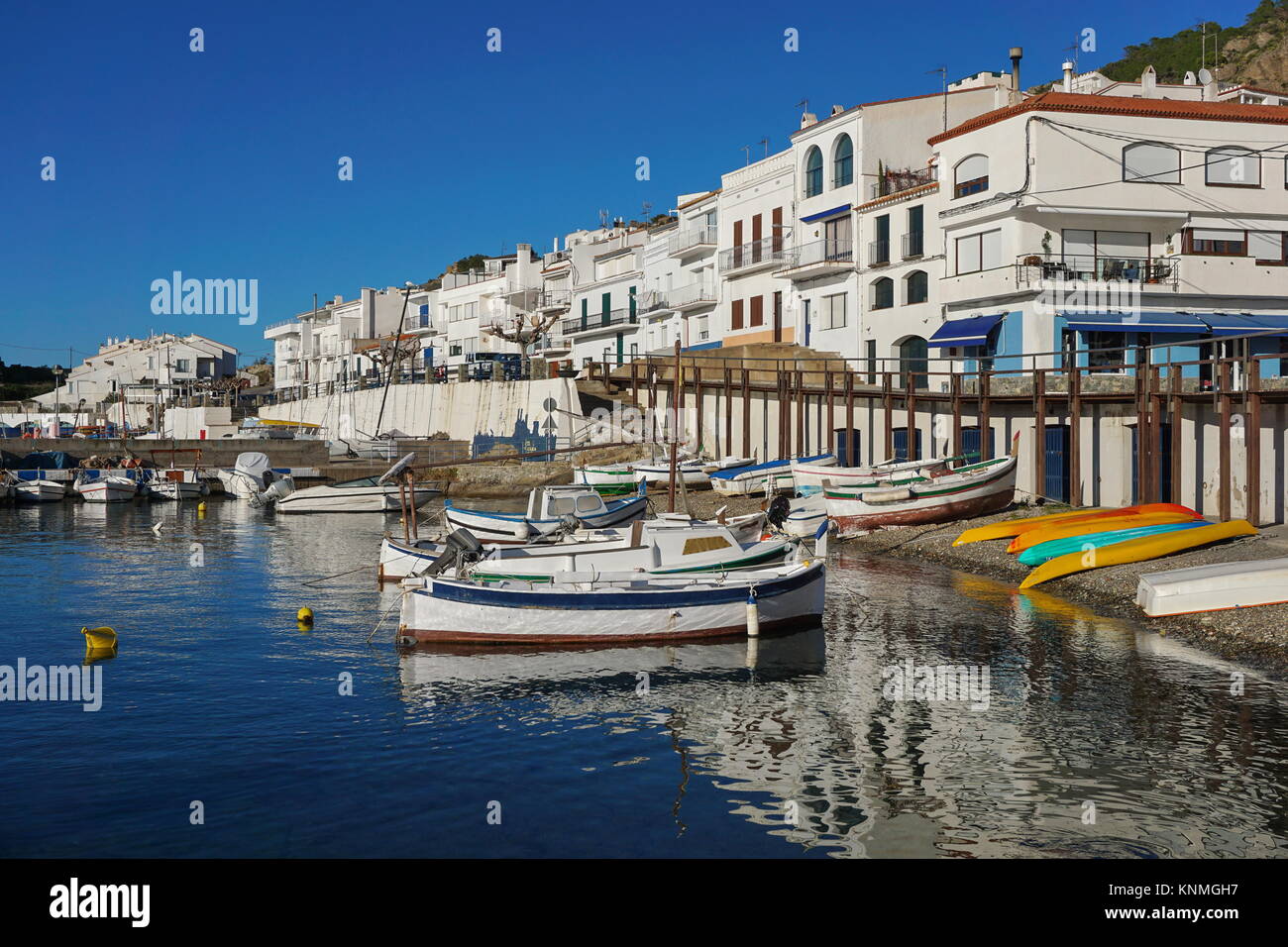 Spain Catalonia Mediterranean village El Port de la Selva with boats on the sea shore, Costa Brava, Alt Emporda Stock Photo