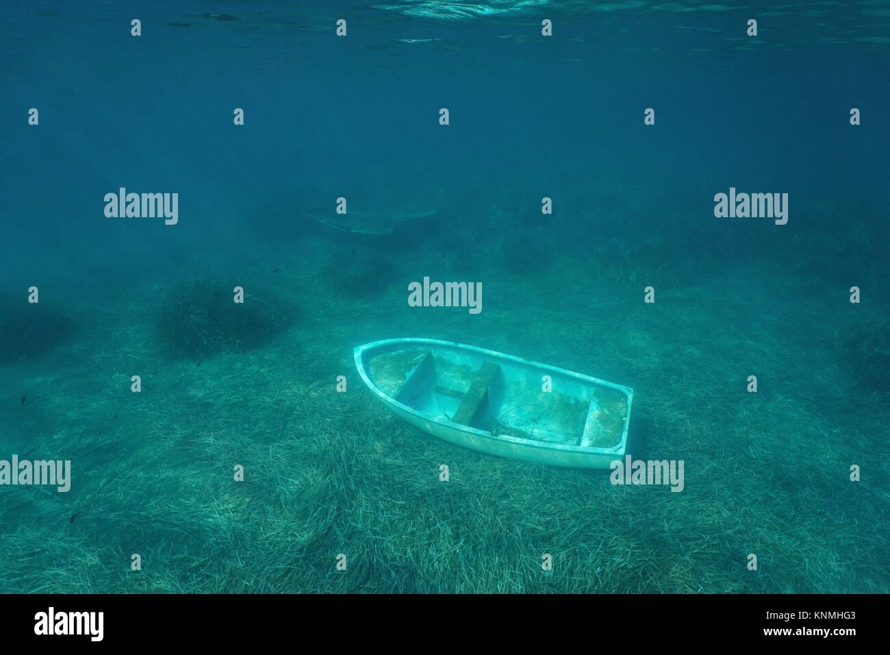 Underwater small sunken boat on the seabed, Mediterranean sea, Catalonia, Costa Brava, Spain Stock Photo