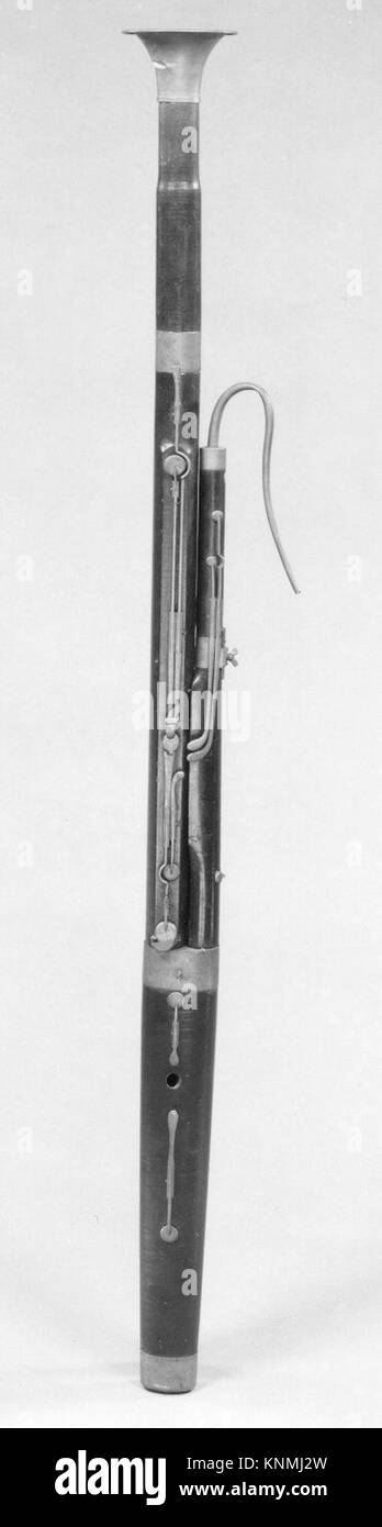 Bassoon, a double-reed woodwind instrument with a long wooden body ...