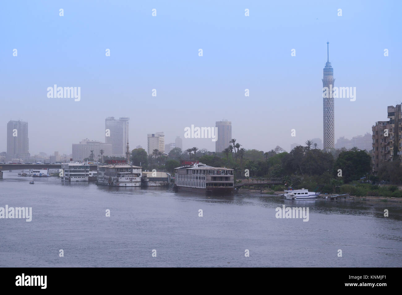 The nile, the Cairo tower with wide view in sunset, and the Kasr El-Nil bridge in Cairo, Egypt Stock Photo