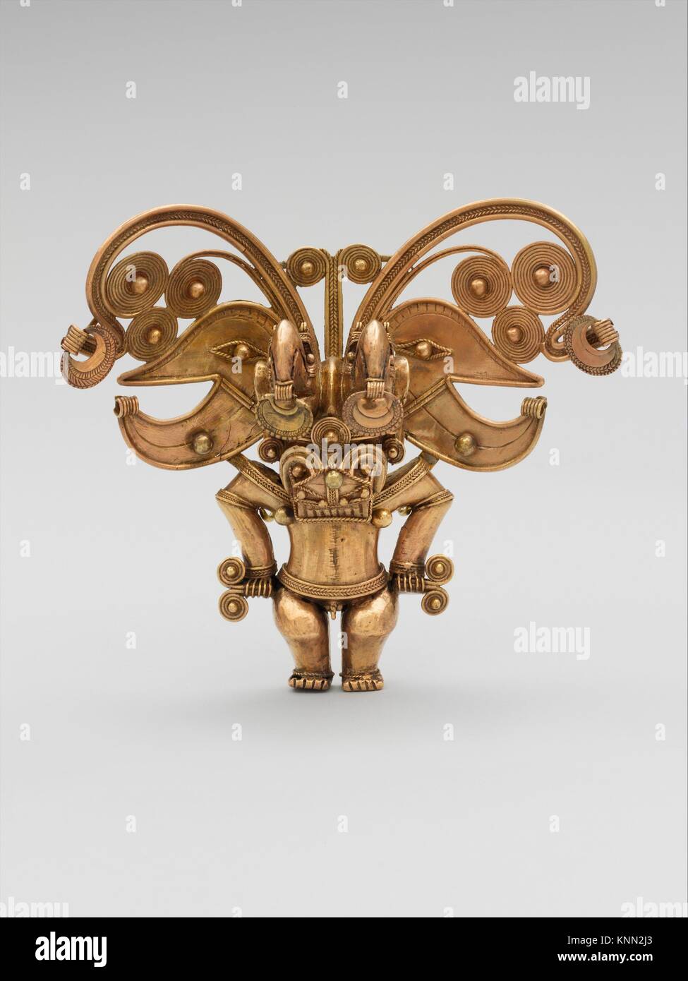 Masked Figure Pendant. Date: 10th-16th century; Geography: Colombia; Culture: Tairona; Medium: Gold; Dimensions: H. 5 1/4 x W. 5 3/4 in. (13.3 x 16.6 Stock Photo