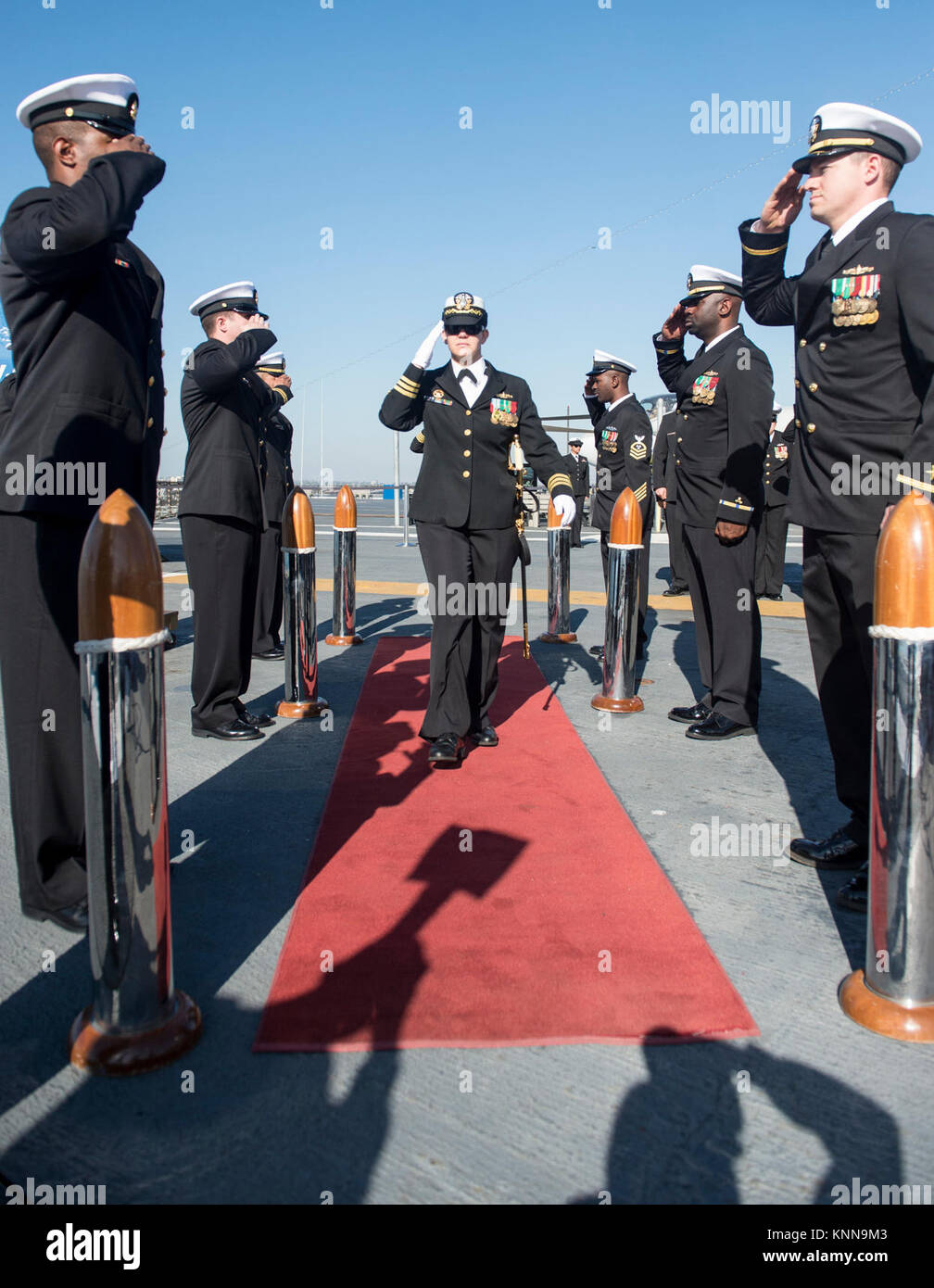 MIDWAY MUSEUM, Calif. (Dec. 01, 2017) CDR Danielle Defant salutes the sideboys as she enters USS Paul Hamilton change of command ceremony. During the ceremony CDR Edward Bertucci relieved CDR Danielle Defant as commanding officer of USS Paul Hamilton. (U.S. Navy Stock Photo