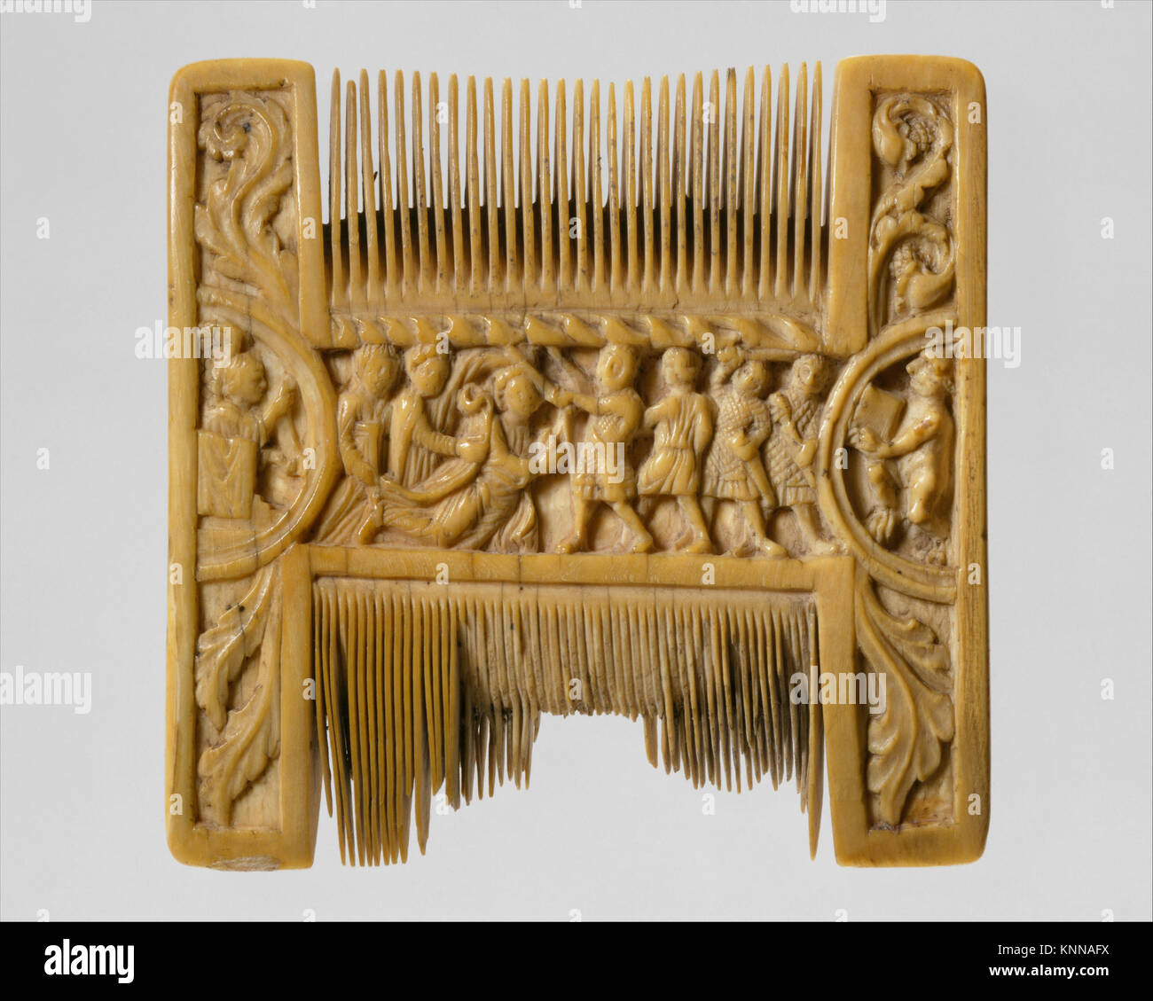 Double-Sided Ivory Liturgical Comb with Scenes of Henry II and Thomas Becket MET DT5979 466161 British, Double-Sided Ivory Liturgical Comb with Scenes of Henry II and Thomas Becket, ca. 1200?1210, Ivory, Overall: 3 3/8 x 3 3/8 x 1/2 in. (8.6 x 8.6 x 1.2 cm). The Metropolitan Museum of Art, New York. Purchase, Rogers Fund, and Schimmel Foundation Inc., Mrs. Maxime L. Hermanos, Lila Acheson Wallace, Nathaniel Spear Jr., Mrs. Katherine S. Rorimer, William Kelly Simpson, Alastair B. Martin and Anonymous Gifts, 1988 (1988.279) Stock Photo