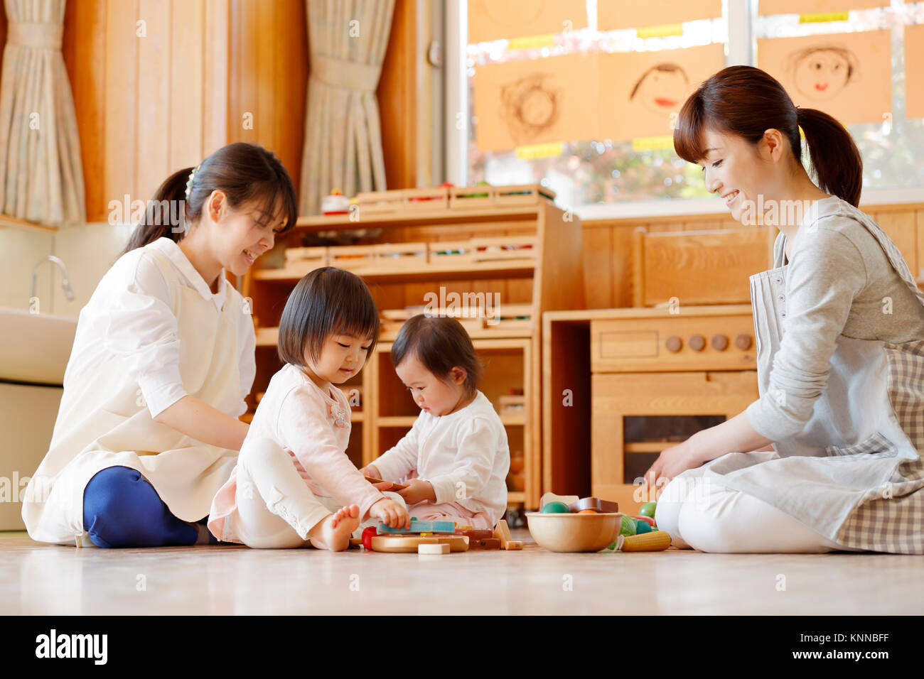 Teachers with kids at Japanese kindergarten Stock Photo