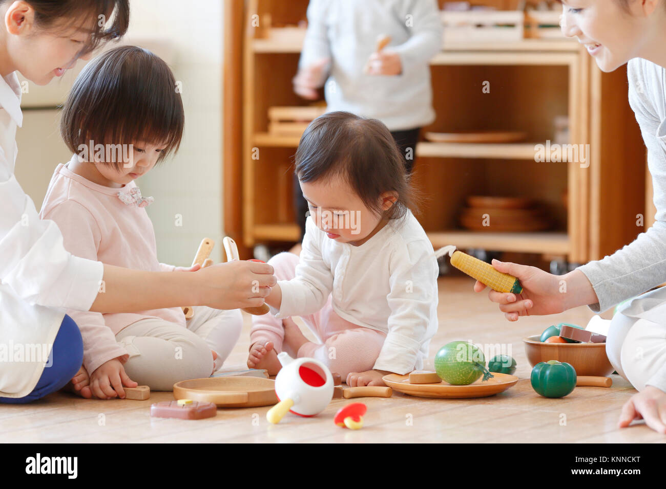 Teachers with kids at Japanese kindergarten Stock Photo