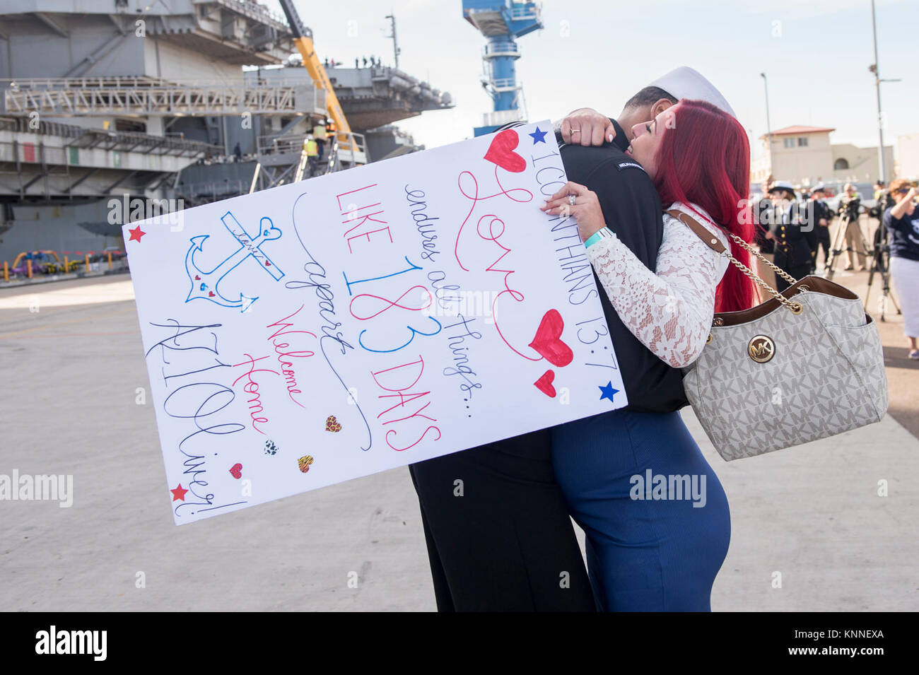 DIEGO (Dec. 05, 2017) Aviation Maintenance Administrationman 1st Class Corey Oliver hugs his pregnant wife after returning from deployment aboard USS Nimitz. The Nimitz Carrier Strike Group is on a regularly scheduled deployment to the Western Pacific. The U.S. Navy has patrolled the Indo-Asia-Pacific region routinely for more than 70 years, prompting peace security. (U.S. Navy Stock Photo
