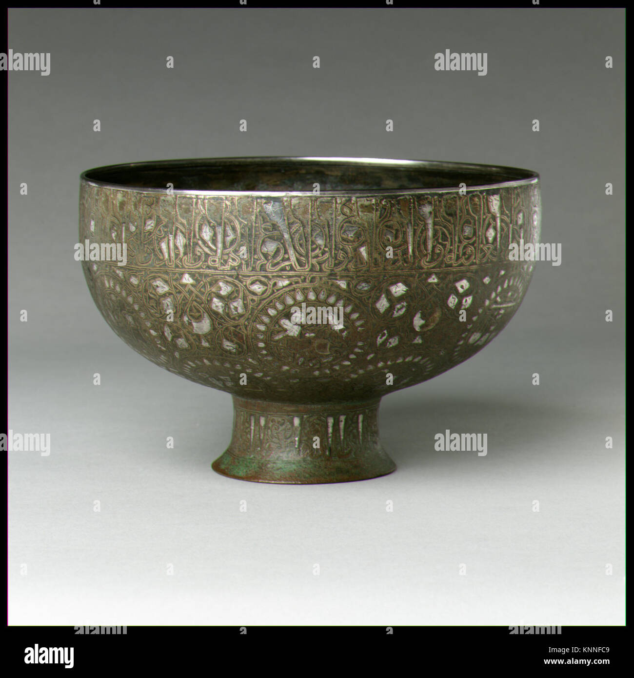 A ceramic footed bowl with a wide rim and elevated base, illustrating ...