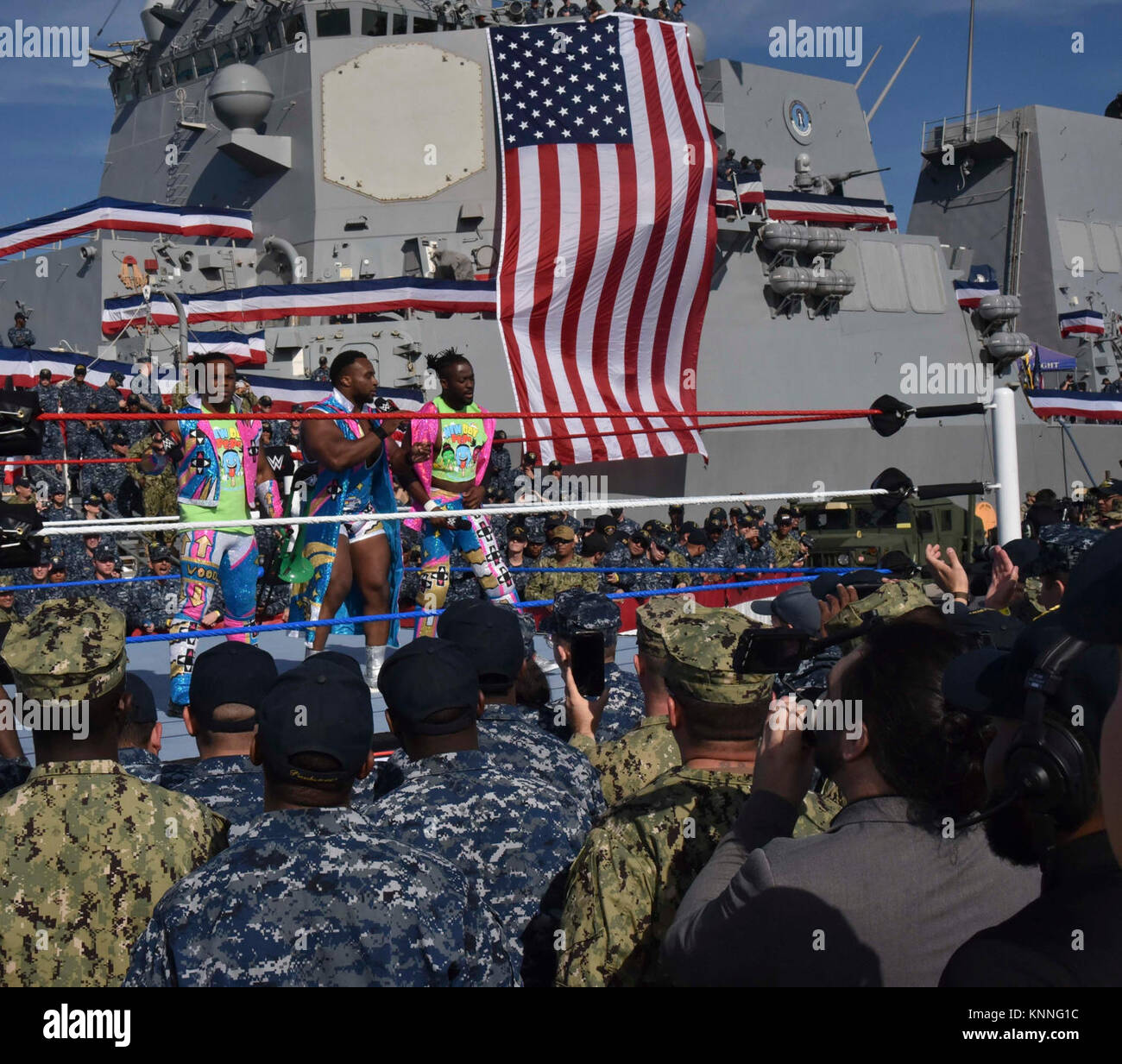 SAN DIEGO (DEC. 5, 2017) World Wrestling Entertainment (WWE) superstars, Xavier Woods, left, “Big E” Langston, center, and Kofi Kingston, talk to Sailors during the 15th annual WWE Tribute to the Troops event, held at Naval Base San Diego. While in San Diego, WWE superstars spent time giving back to military personnel and their families. Activities included a bullying prevention rally, as well as hospital visits and military outreach initiatives at various installations, including Naval Base San Diego, Naval Air Station North Island and Naval Medical Center San Diego. (U.S. Navy Stock Photo