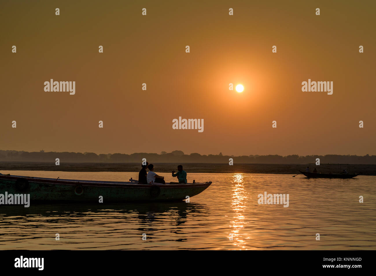 Silhouette Boat at the time of Sunset Stock Photo - Alamy