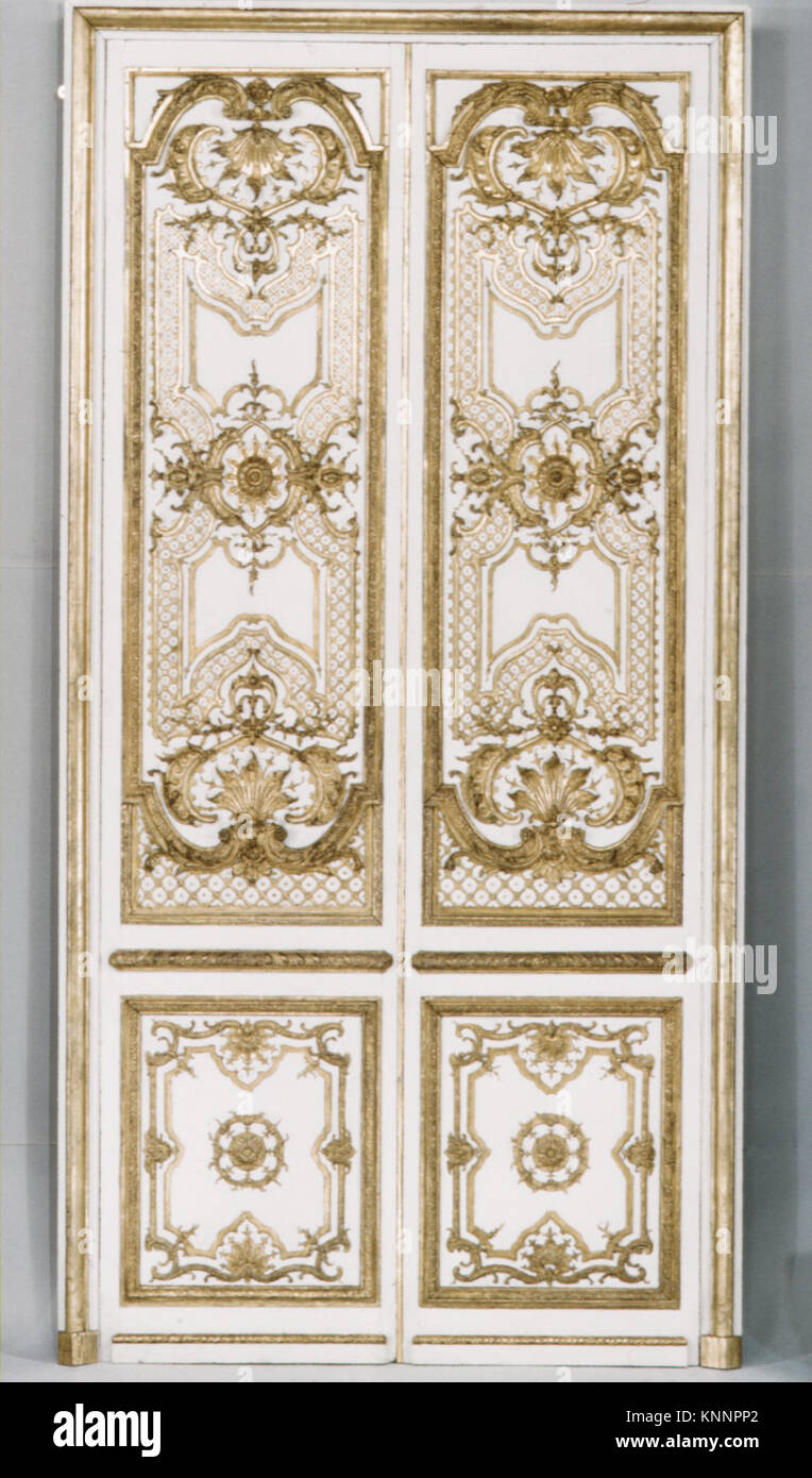 Double door- four panels, two pilasters, three gilt moldings for the door frame MET ES7661 Double door- four panels, two pilasters, three gilt moldings for the door frame MET ES7661 /189702 French, Double door: four panels, two pilasters, three gilt moldings for the door frame, ca. 1715, Carved, painted and gilded oak, a,b -  doors with their trim i,j,k: 106-1/4 x 53-1/2 in. (269.9 x 135.9 cm) c,e,f,h -  panels:  H. from 102 to 104-3/4 in. (259.1 to 266.1 cm); W. from 20-1/2 to 22 in. (52.1 to 55.9 cm) d - pilaster:  94-1/2 x 12 in. (240 x 30.5 cm) g - pilaster: 94-1/2 x 12-1/2 in. (240 x 31.8 Stock Photo