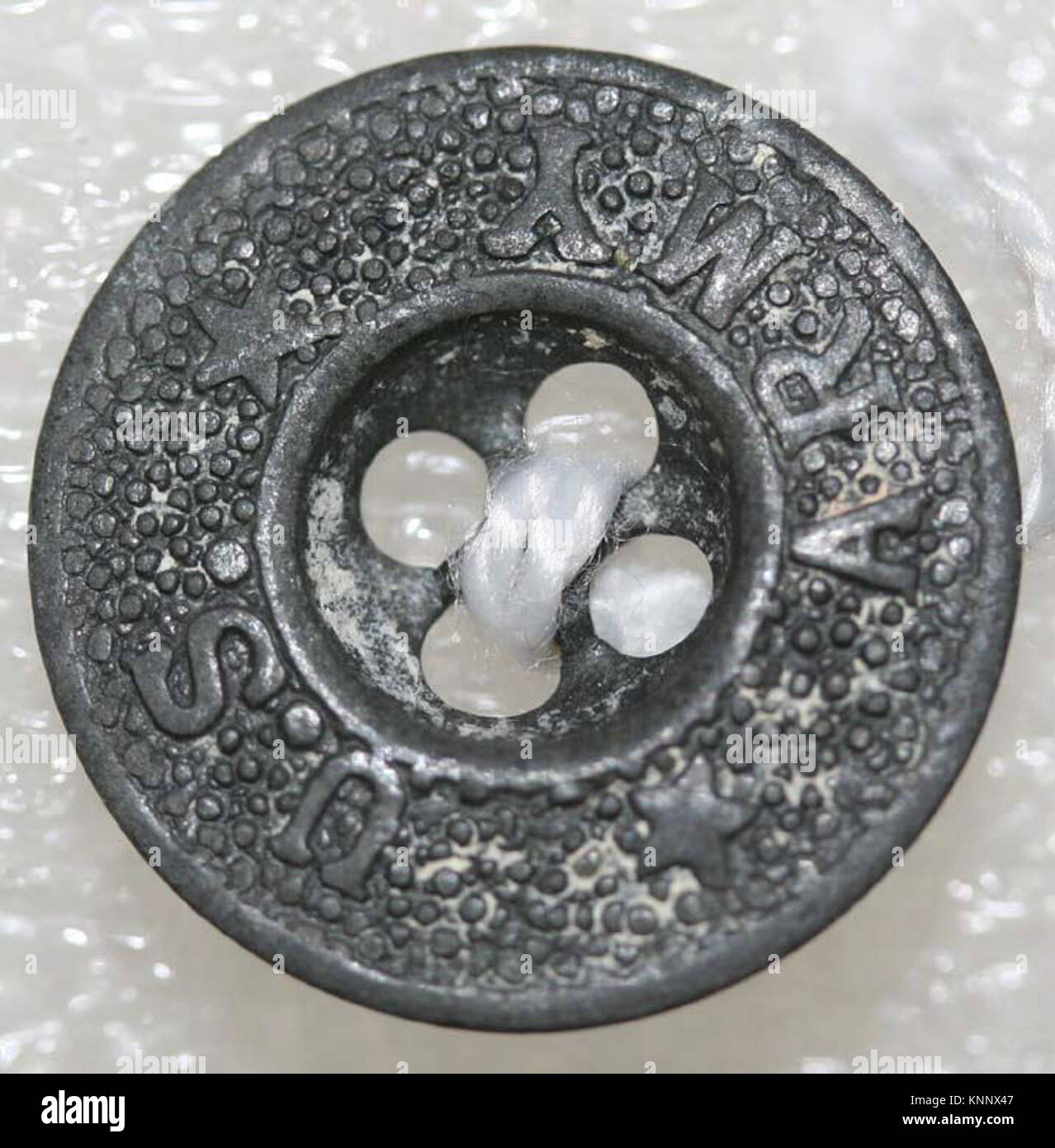 An ancient button catalogued as MET 51.47.1555 in the Metropolitan ...